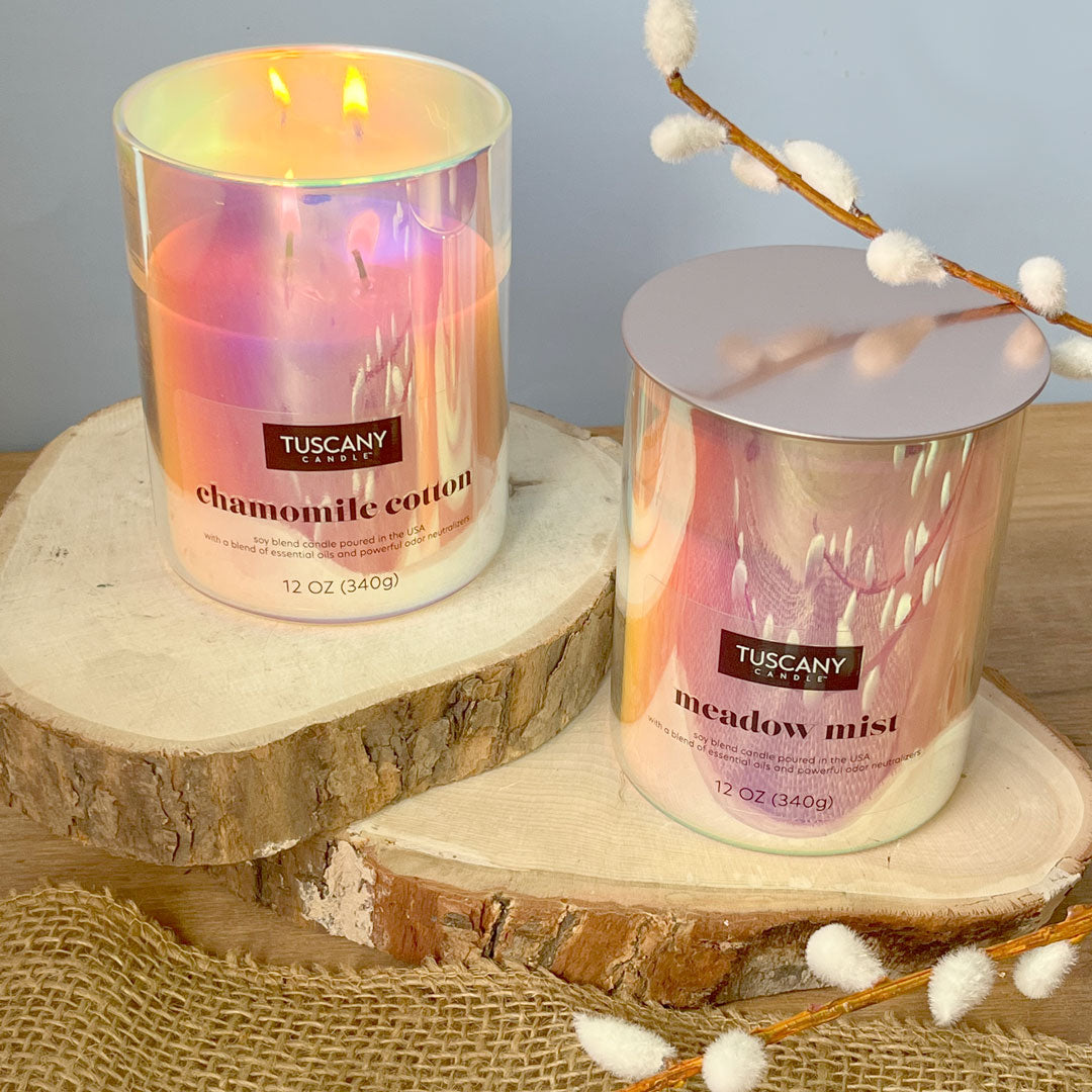 Two Serene Clean® odor-destroying candles are shown in a still life photo