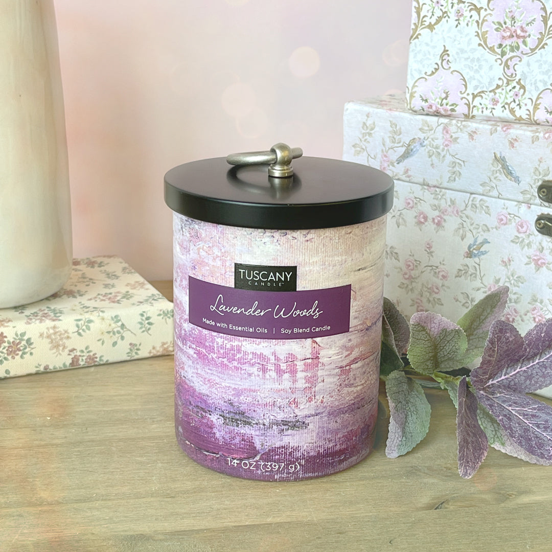 A jar of Lavender Woods scented candle, perfect for home décor and featuring the soothing fragrance of essential oils, from Tuscany Candle.