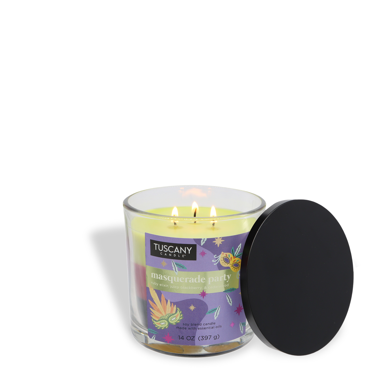 A lit yellow Tuscany Candle® SEASONAL "Masquerade Party: Blackberry & Birch Bark" Halloween candle (14 oz) in a glass jar, with a black lid on the side.