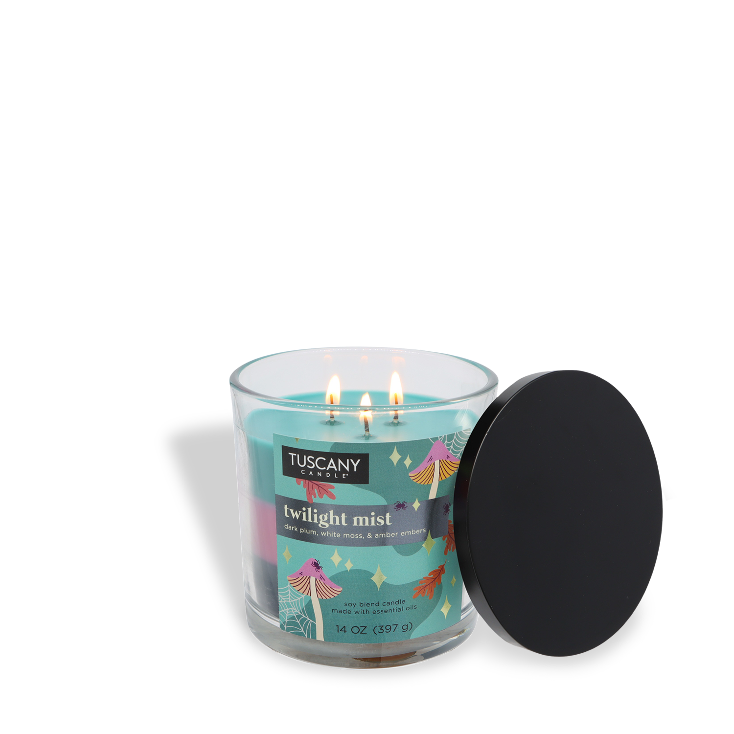A lit Tuscany Candle® SEASONAL Twilight Mist: Dark Plum & Amber Embers Halloween Candle (14 oz) with two burning wicks sits in a glass jar, "twilight mist" label visible, black lid resting to the side.
