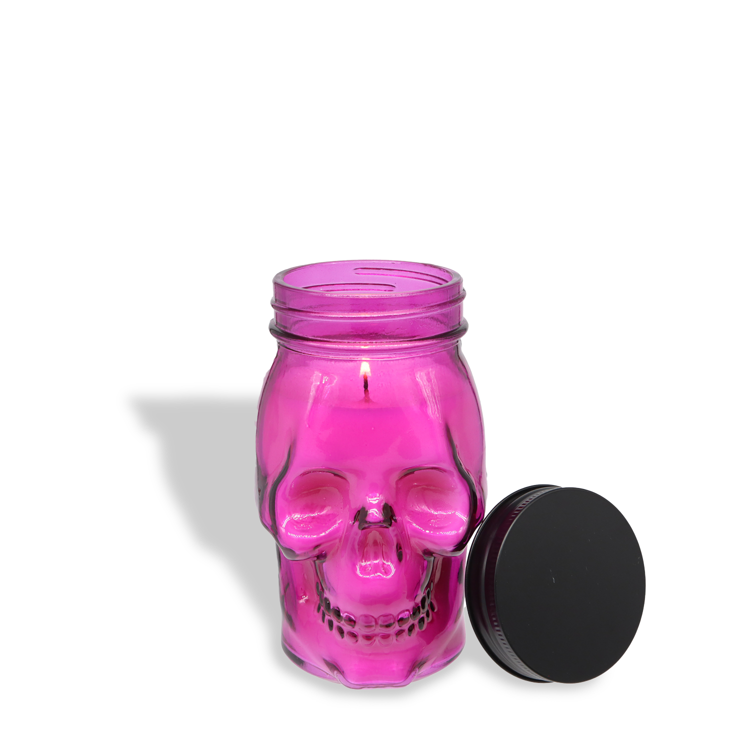 The Wicked Santal: Spiced Palo Santo & Lush Violet Halloween Candle (12 oz) from Tuscany Candle® SEASONAL’s Spooky Skull Collection adds a quirky touch to your décor with its pink skull-shaped Mason jar and black lid.