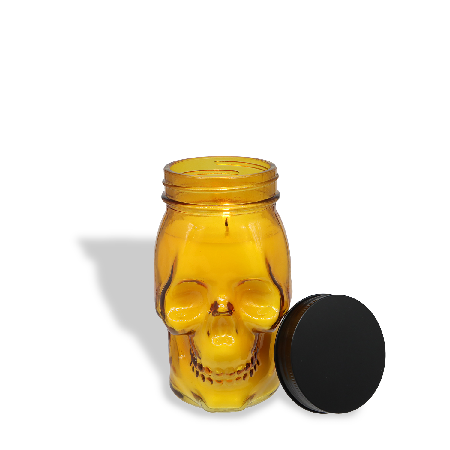The Tuscany Candle® SEASONAL Charmed Pumpkin: Black Cardamom & Pumpkin Scented Halloween Candle (12 oz), from the Spooky Skull Collection, is a festive addition to your autumn home decor.