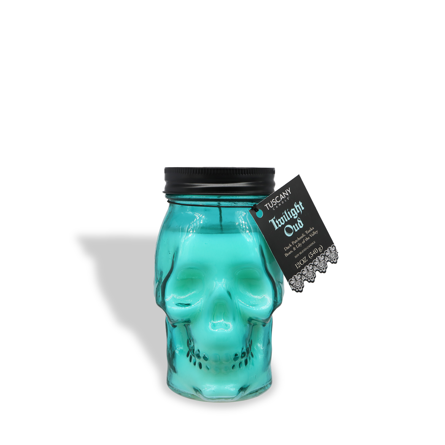 The Twilight Oud: Dark Patchouli & Rich Oud Scented Halloween Candle (12 oz) from Tuscany Candle® SEASONAL features a turquoise skull-shaped glass jar, black lid, and "Tuscany Twilight Oud" tag—perfect for gothic décor or as a unique Halloween accent.