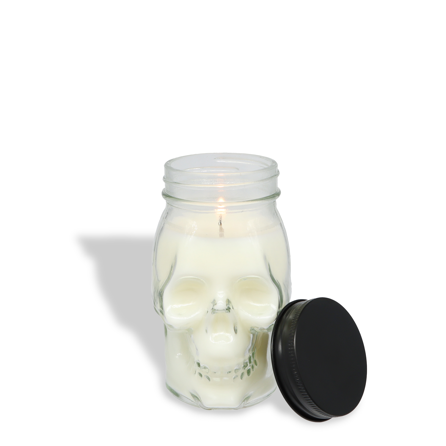 The Tuscany Candle® SEASONAL Phantom Fog: Pink Pepper & Rich Sandalwood Scented Halloween Candle (12 oz) from the Spooky Skull Collection features a lit white skull design in a glass jar, soy blend wax, and a black lid on a white background.