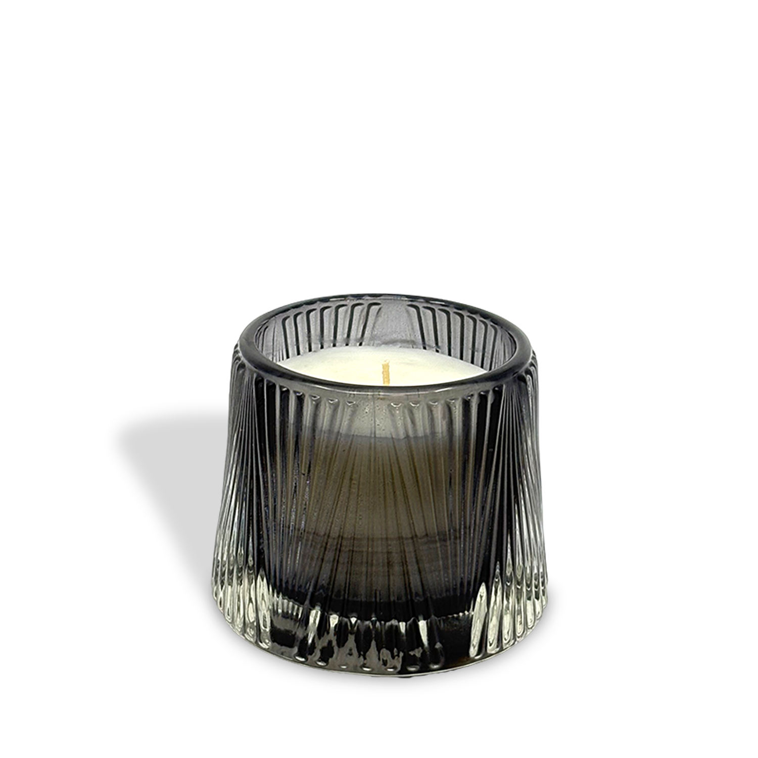 The est.1951 Bergamot & Musk (4oz) luxury small candle comes in a ribbed, transparent dark glass holder, shown on a white background with a faint shadow to the left.