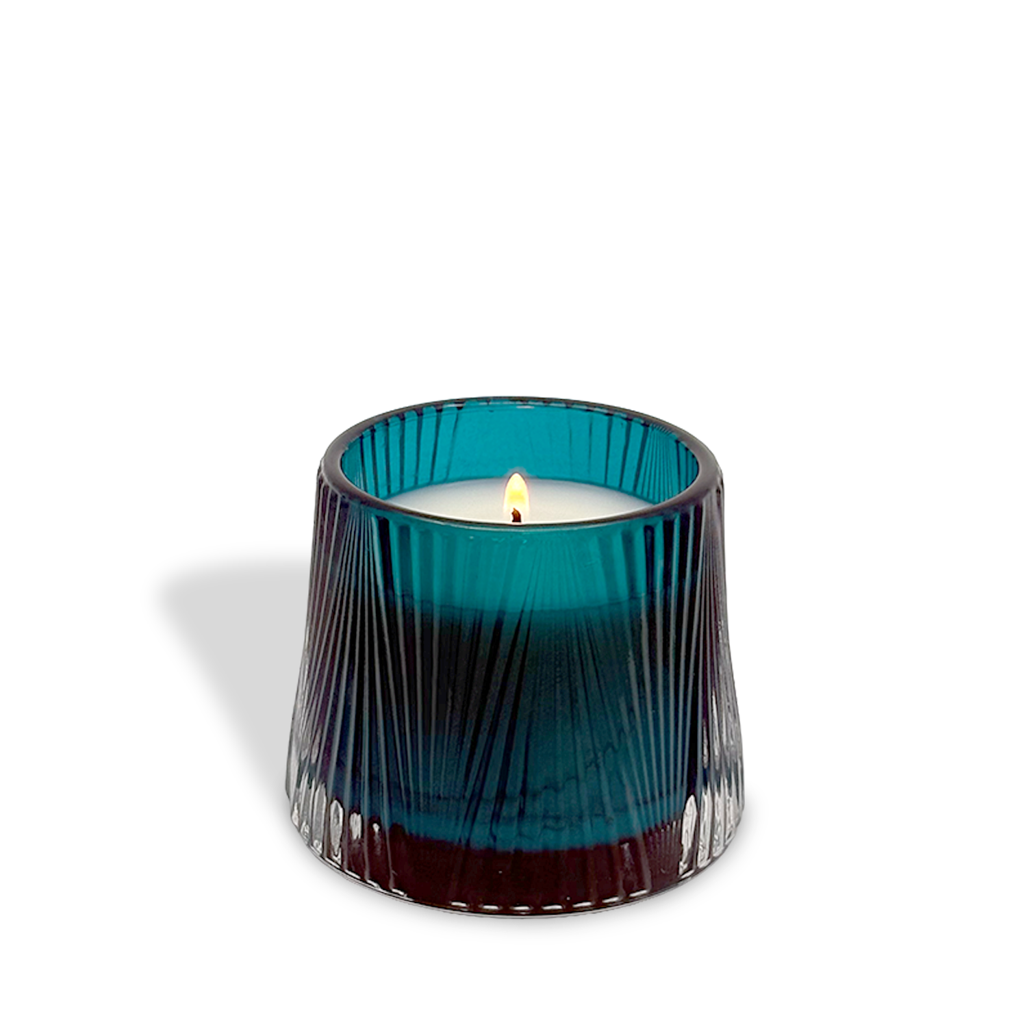The est.1951 Midnight Iris & Verbena (4oz) candle features a petite, ribbed blue-green gradient glass holder, casting a soft shadow on a white background.