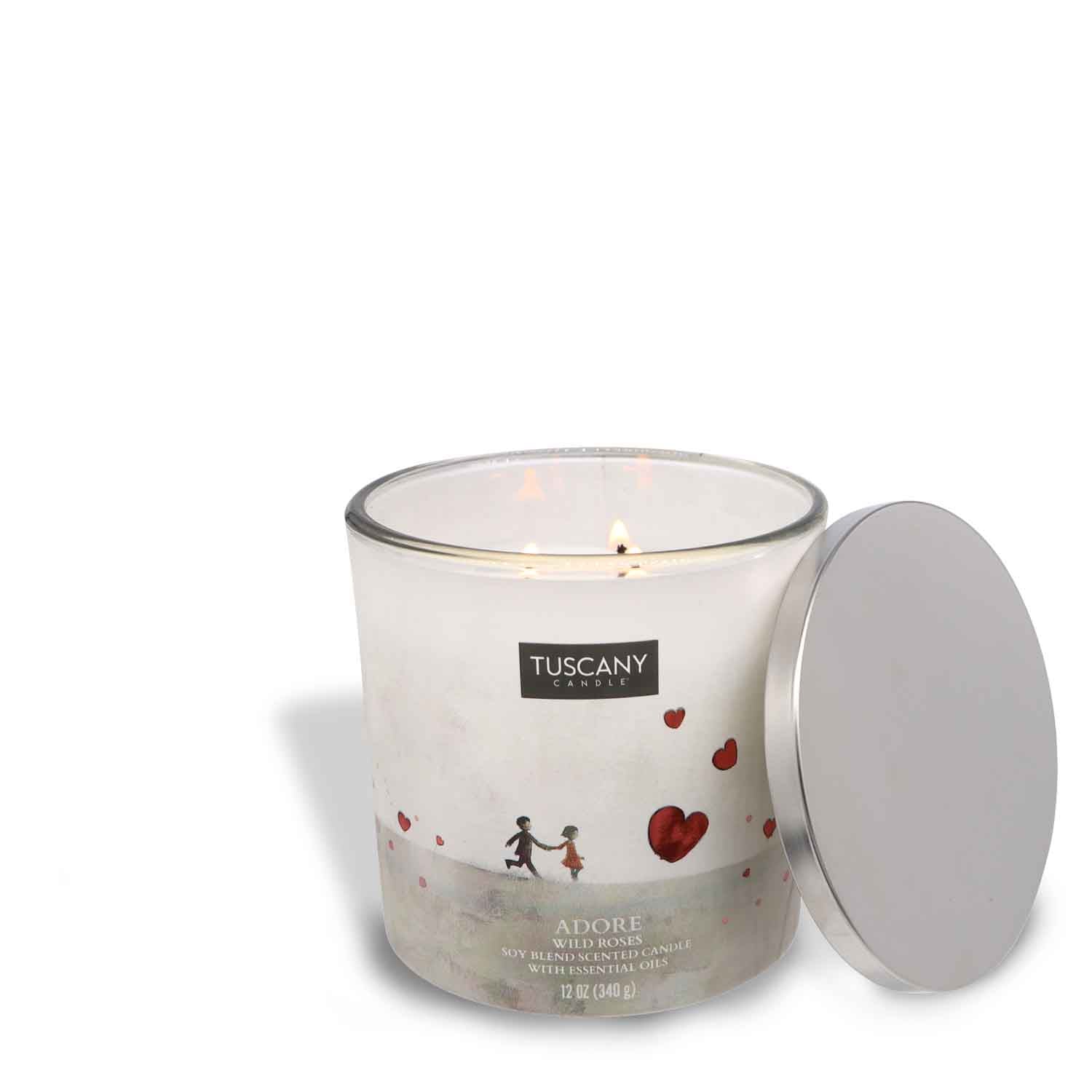 A Adore Scented Jar Candle (12 oz) from the Carried Away collection adorned with a delicate heart on its lid, exuding floral elegance.