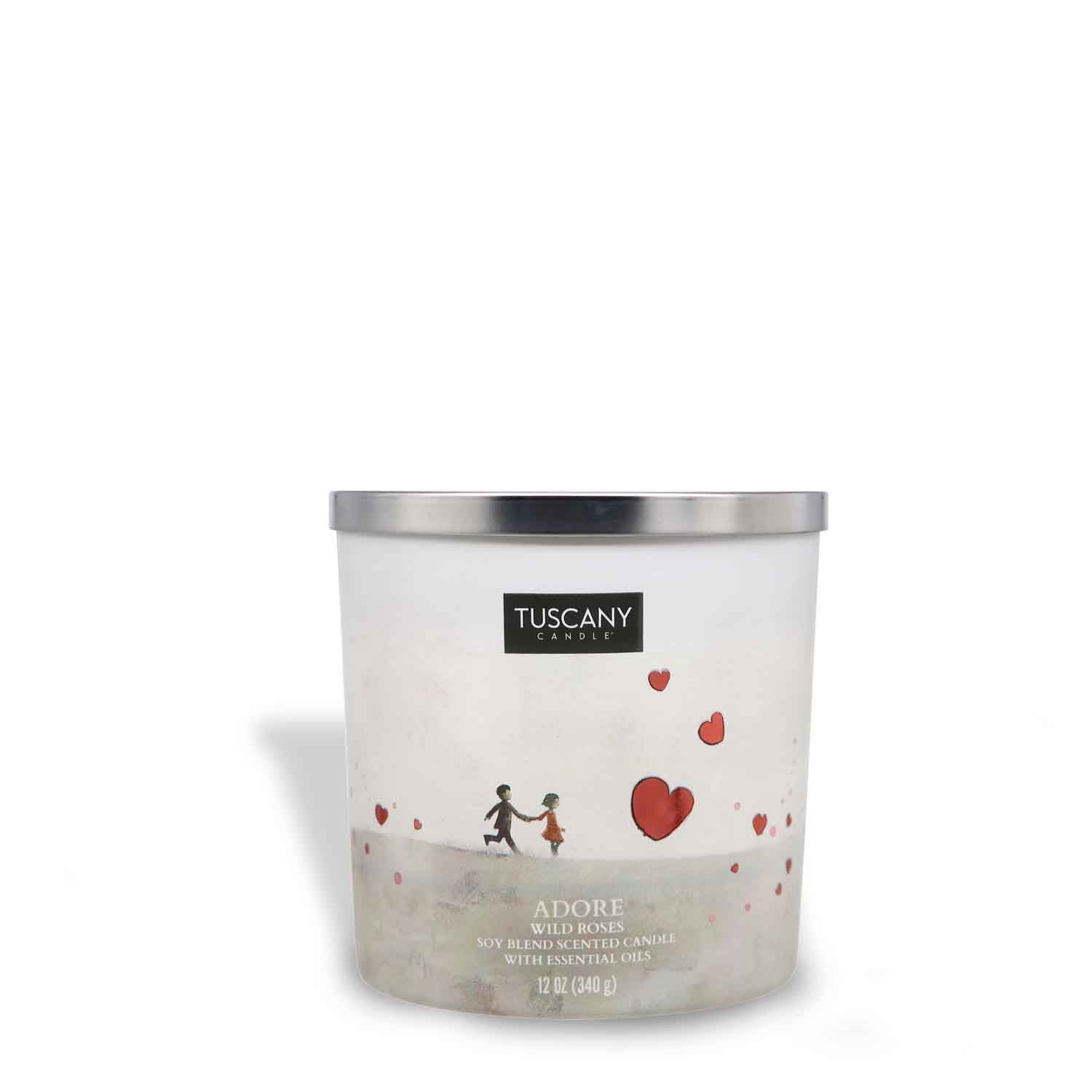A white Adore Scented Jar Candle (12 oz) with a heart on it, part of the Carried Away collection from Tuscany Candle® SEASONAL.