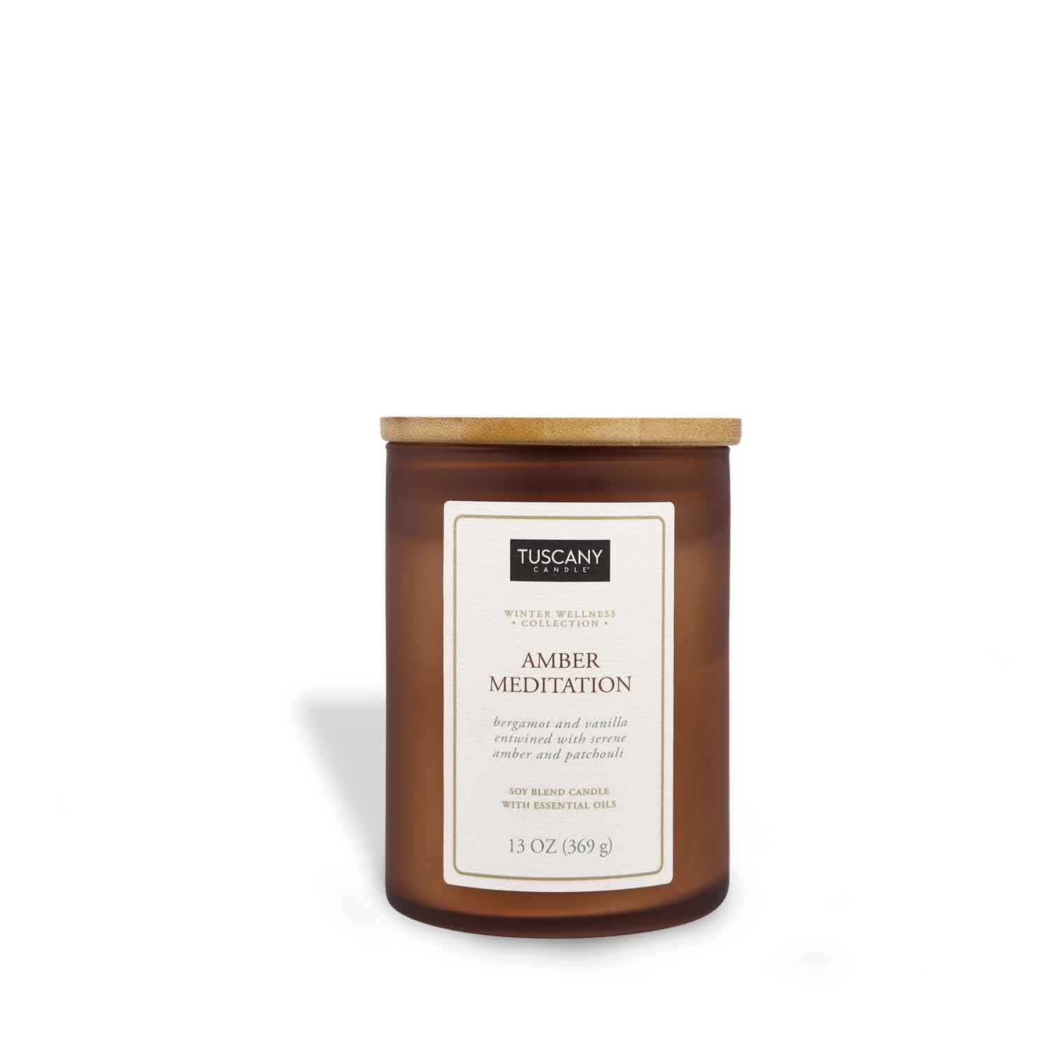A Tuscany Candle Amber Meditation Scented Jar Candle (13 oz) – Winter Wellness Collection with a brown lid on a white background.