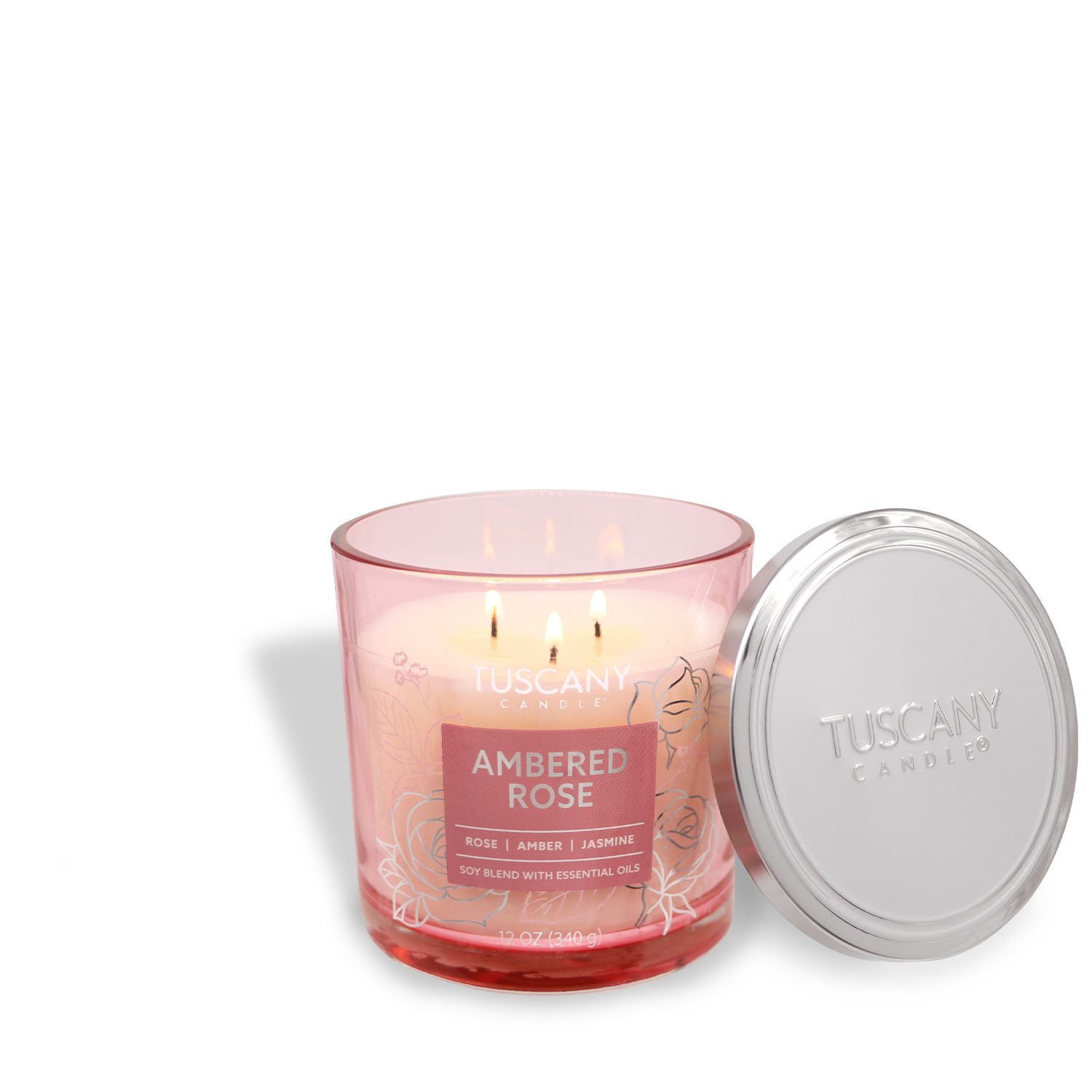 A lit pink Tuscany Candle® EVD from the Painters' Palette Collection, labeled "Ambered Rose: Jasmine Scented Jar Candle (12 oz)," with a silver lid beside it.