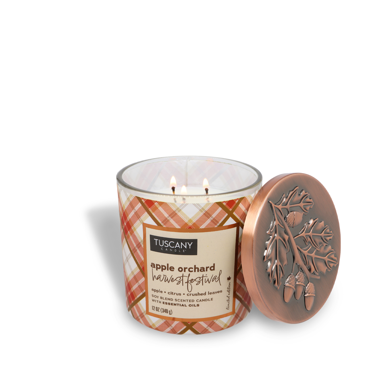 A lit Tuscany Candle® SEASONAL labeled "Apple Orchard Harvest Festival Long-Lasting Scented Jar Candle (12 oz)" from the Autumn Flannels Collection, with a delightful blend of apple, citrus, and crushed leaves scent. The candle features two wicks and comes with a decorative lid adorned with acorns and oak leaves, making it a perfect addition to your Seasonal Home Fragrance collection.