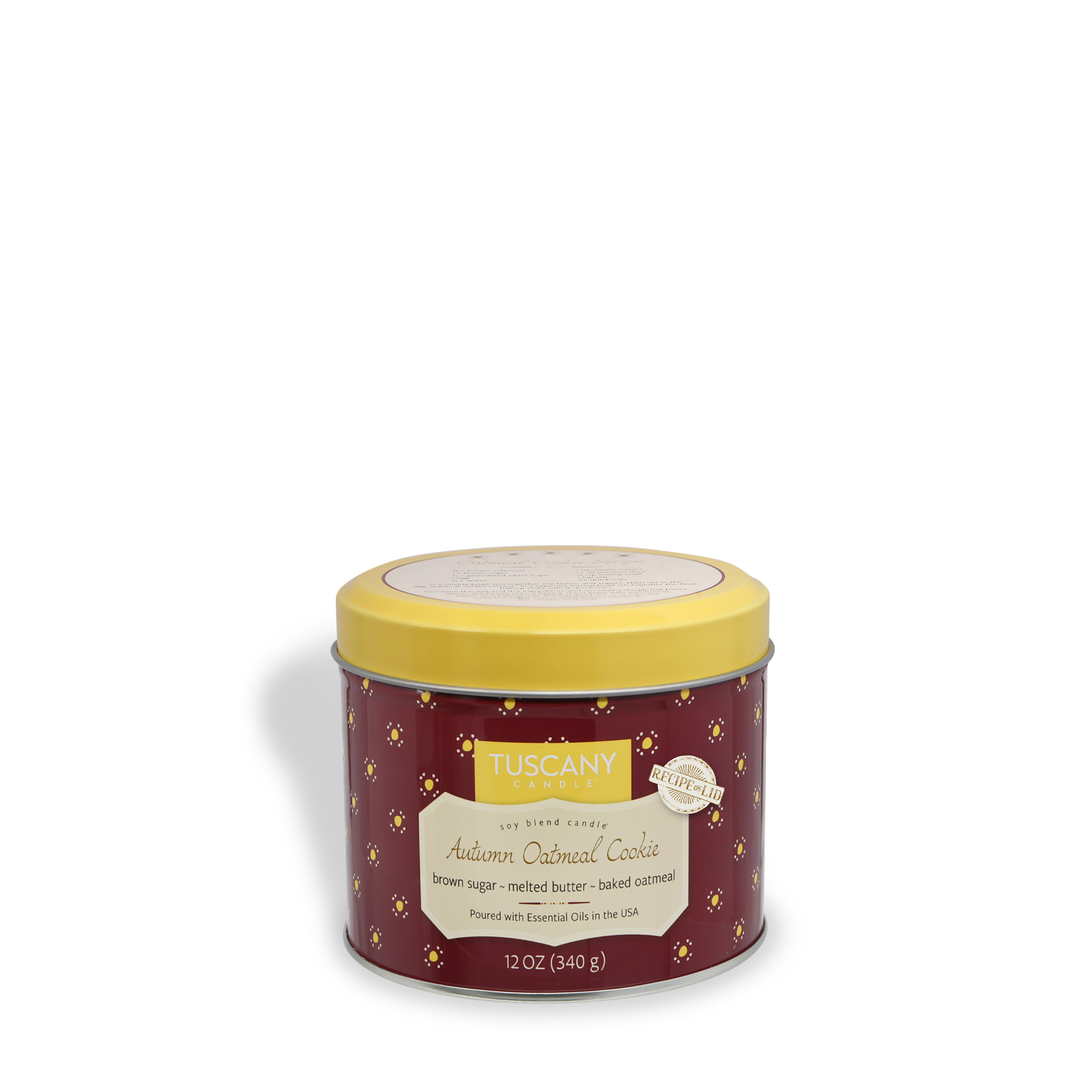 A round tin with a yellow lid labeled "Autumn Oatmeal Cookie: Harvest Spices Scented Fall Candle," 12 oz, from Tuscany Candle® SEASONAL Bakery Tins Collection, featuring decorative patterns.