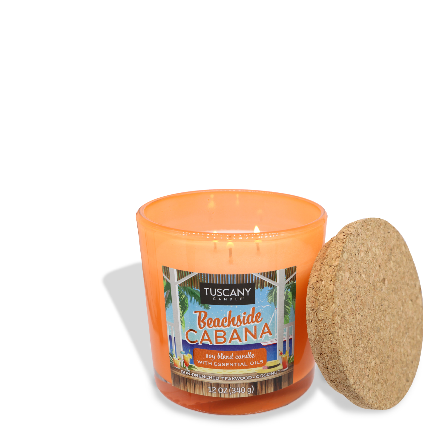 An orange Tuscany Candle® SEASONAL with a "Beachside Cabana" label and essential oils, featuring the warm scent of vanilla teak, lit and placed next to its cork lid.