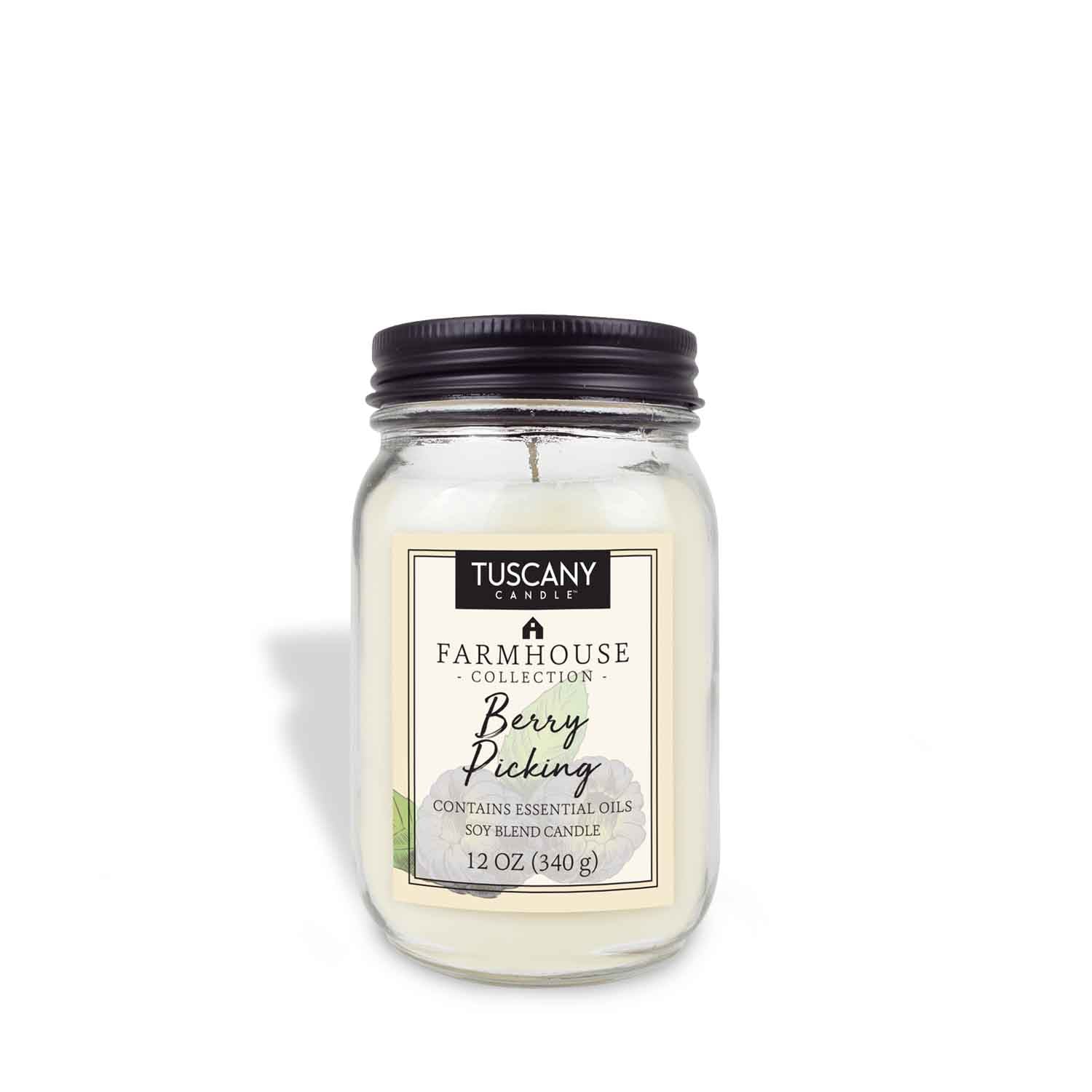 Explore the 12 oz "Berry Picking" Scented Jar Candle from Tuscany Candle® EVD's Farmhouse Collection. Crafted with essential oils and a soy blend, this rustic candle is elegantly packaged in a clear jar with a black lid.