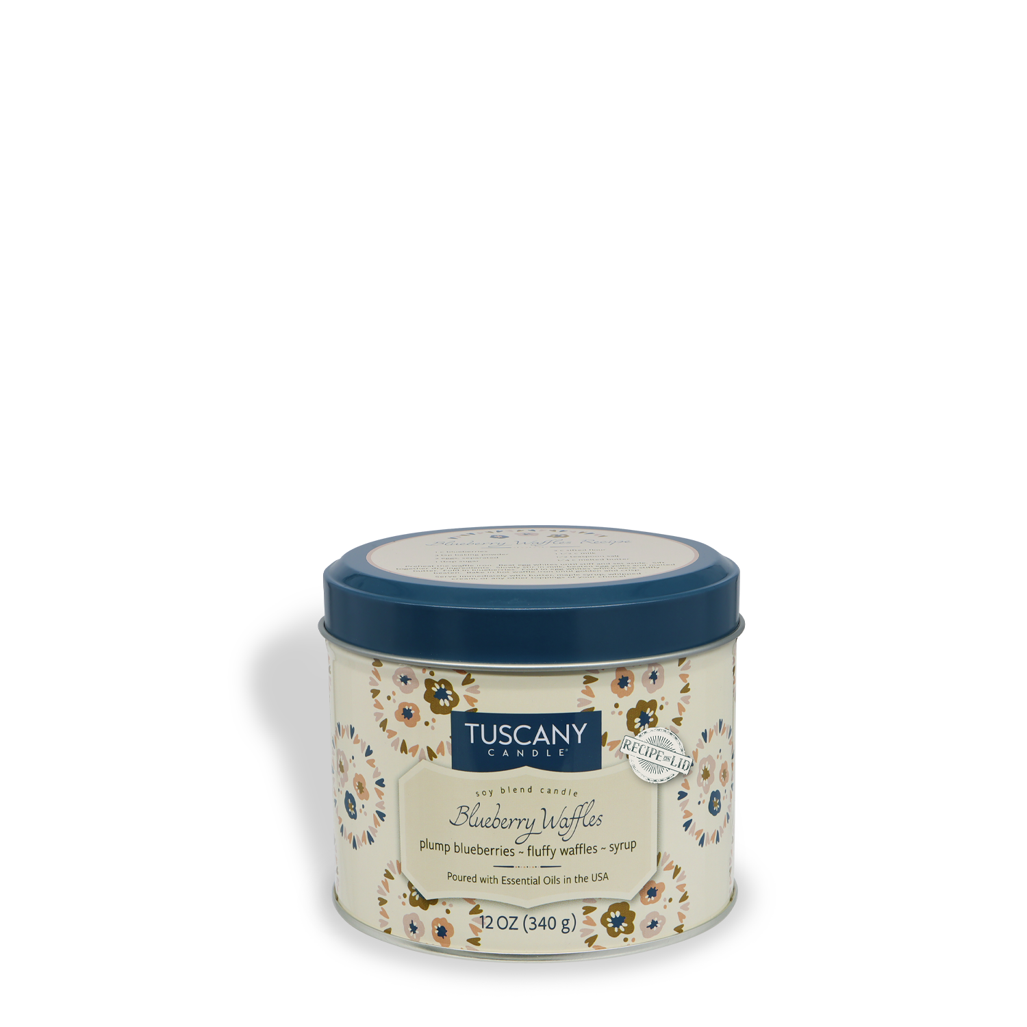 A round, cream-colored Tuscany Candle® SEASONAL tin with floral designs and a blue lid, labeled "Blueberry Waffles: Maple Syrup & Waffle Scented Fall Candle" (12 oz) from the Bakery Tins Collection.