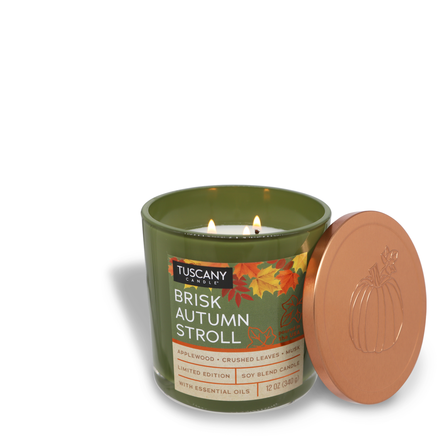 The "Brisk Autumn Stroll Long-Lasting Scented Jar Candle (12 oz)" from the Tuscany Candle® SEASONAL Copper Harvest Collection comes in a green glass jar. It features applewood, crushed leaves, and musk scents. Removing its copper lid adorned with a pumpkin design reveals two wicks that, when lit, fill the room with inviting warmth.