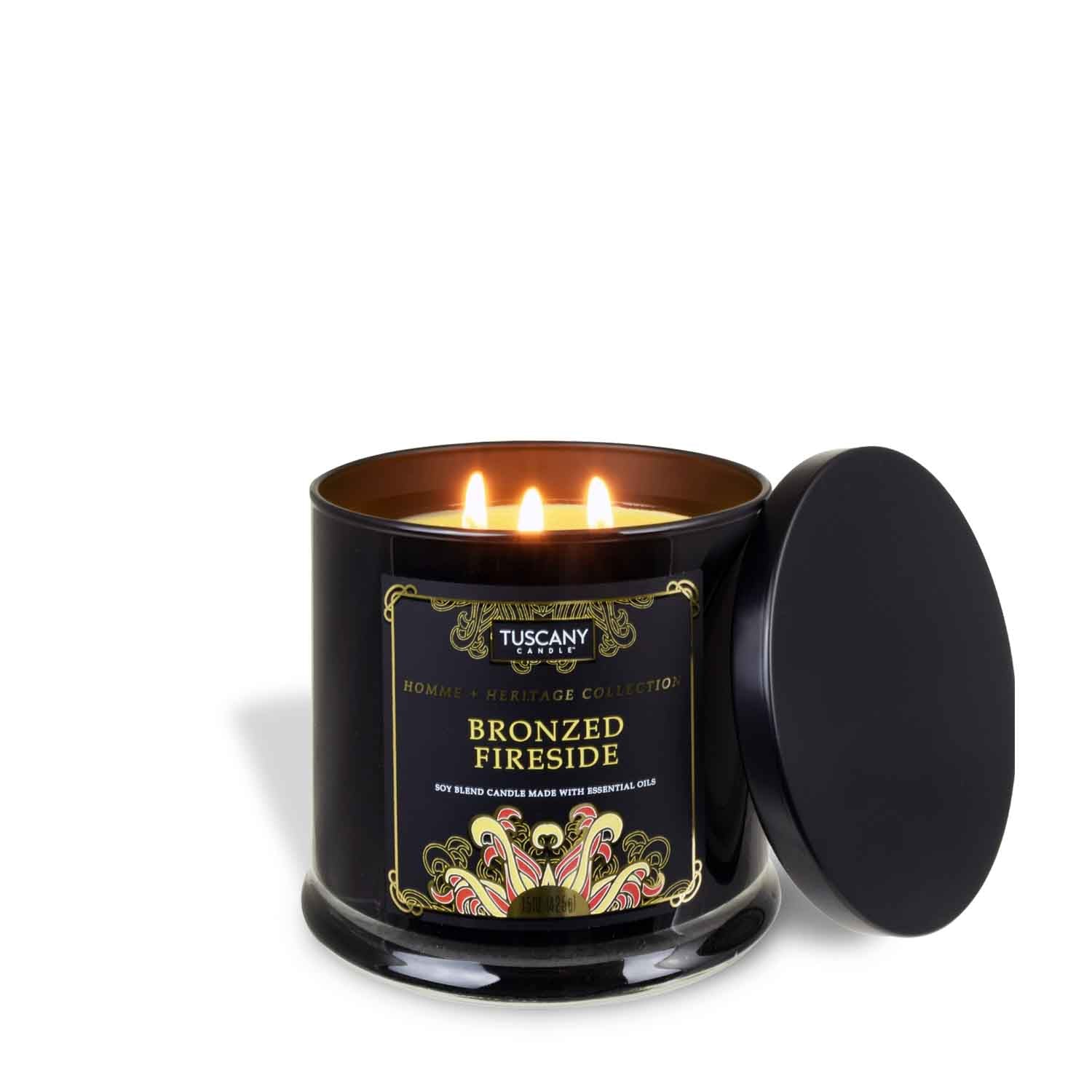 A Bronzed Fireside Scented Jar Candle (15 oz) from the Homme + Heritage Collection by Tuscany Candle in a black tin on a white background.