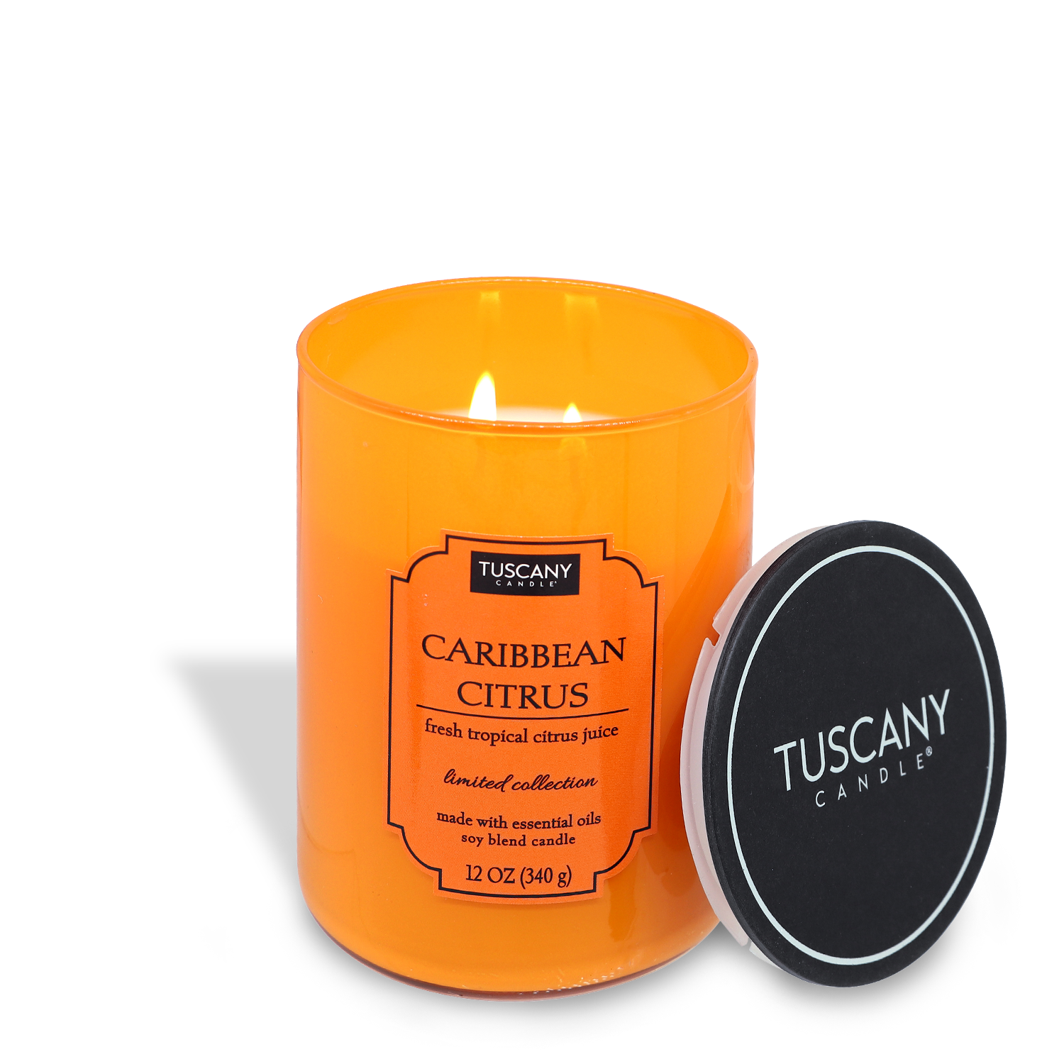 A Tuscany Candle® EVD Caribbean Citrus (12 oz) candle with a tropical citrus juice scent, housed in an orange glass container with its black lid positioned to the side.