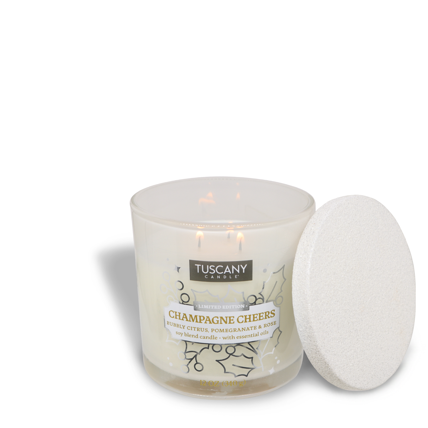 Tuscany Candle® SEASONAL’s "Champagne Cheers Scented Jar Candle (12 oz)" features two lighted wicks, with its lid placed beside the jar.