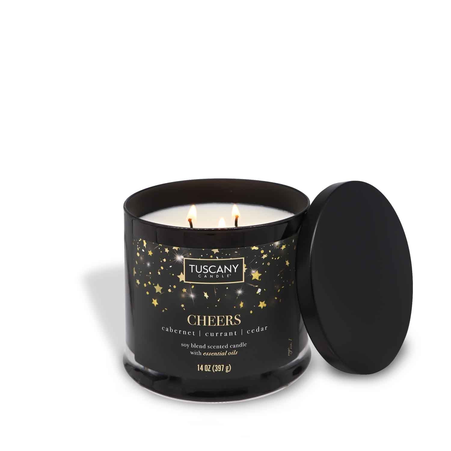A Cheers scented candle adorned with stars and a black lid, perfect for holiday celebrations.