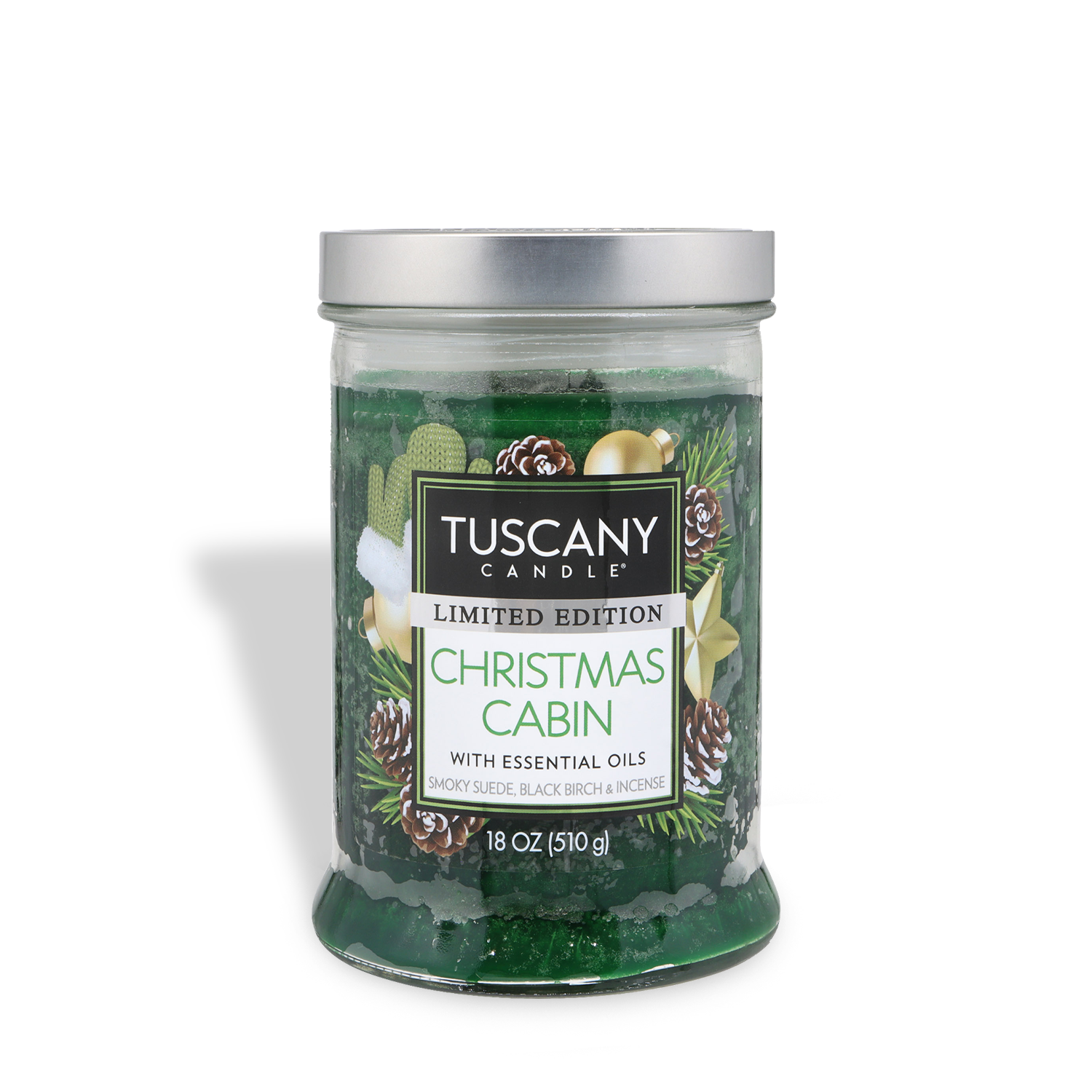An 18 oz glass jar of Tuscany Candle® SEASONAL Christmas Cabin: Smoky Suede & Birch scented holiday candle, limited edition, with green wax and a silver lid featuring a pine and pinecone label design.