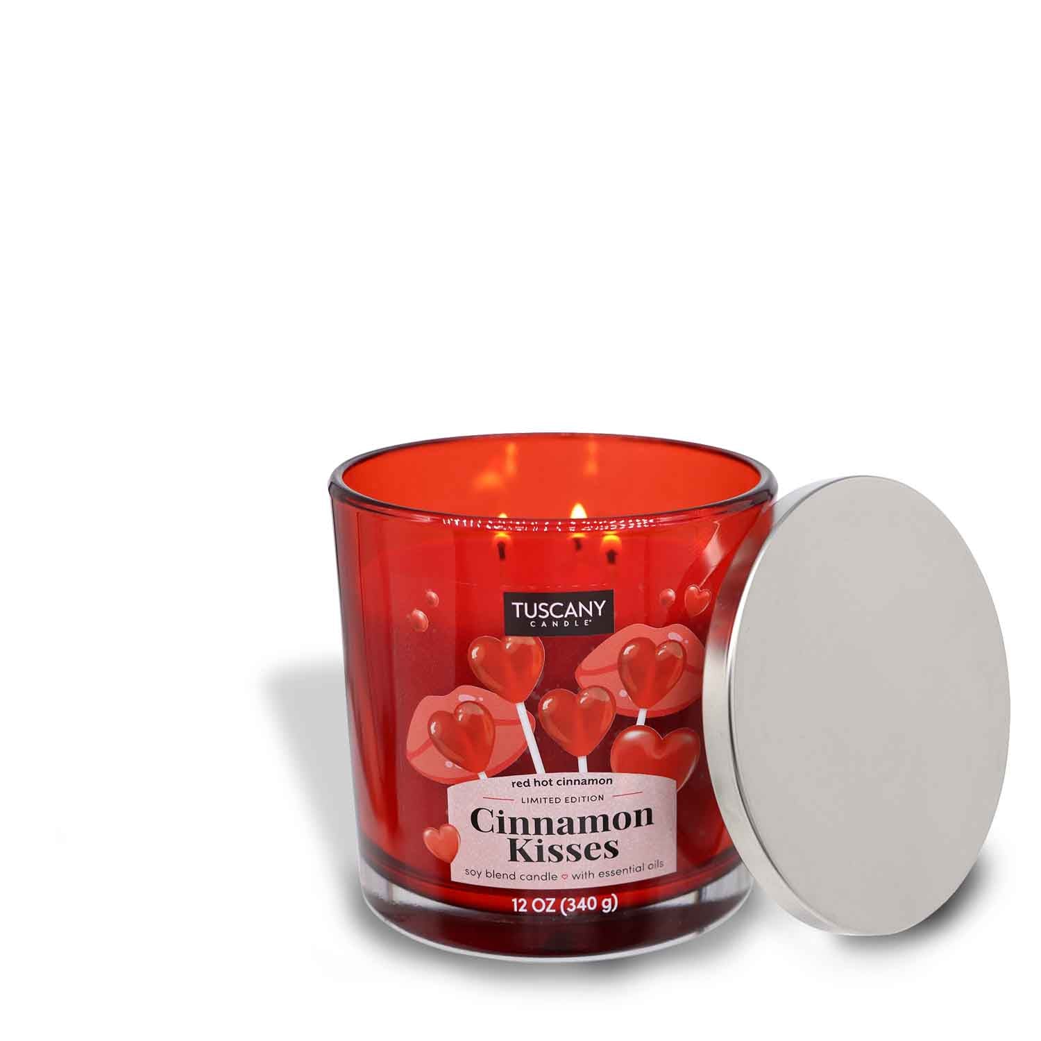 A Cinnamon Kisses scented candle with a red lid from Tuscany Candle® SEASONAL.