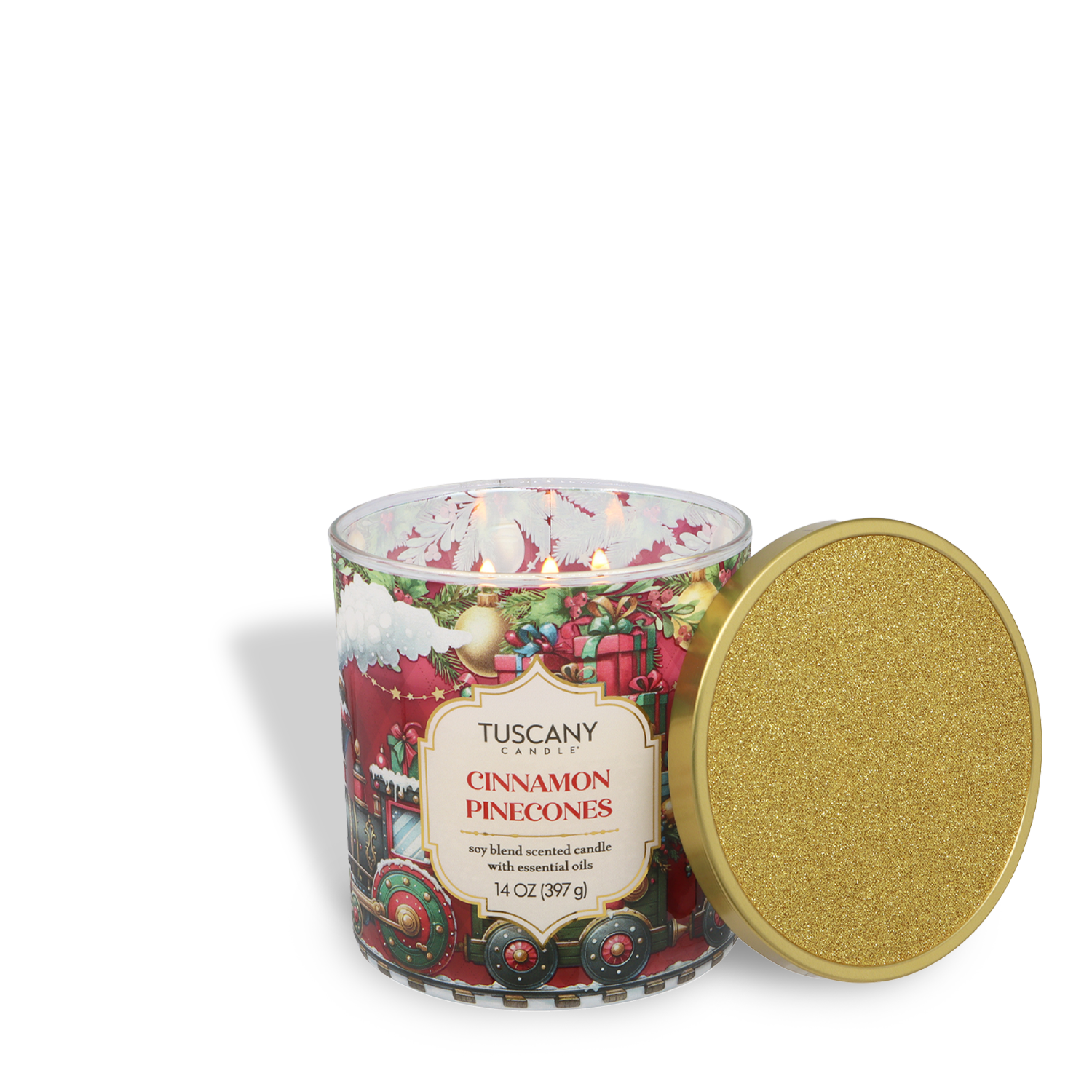 A Tuscany Candle® SEASONAL "Cinnamon Pinecones: Warm Cinnamon & Clove Scented Holiday Candle" (14 oz) from the Traditions Collection, in a festive Christmas train glass jar, with a gold glitter lid beside it.