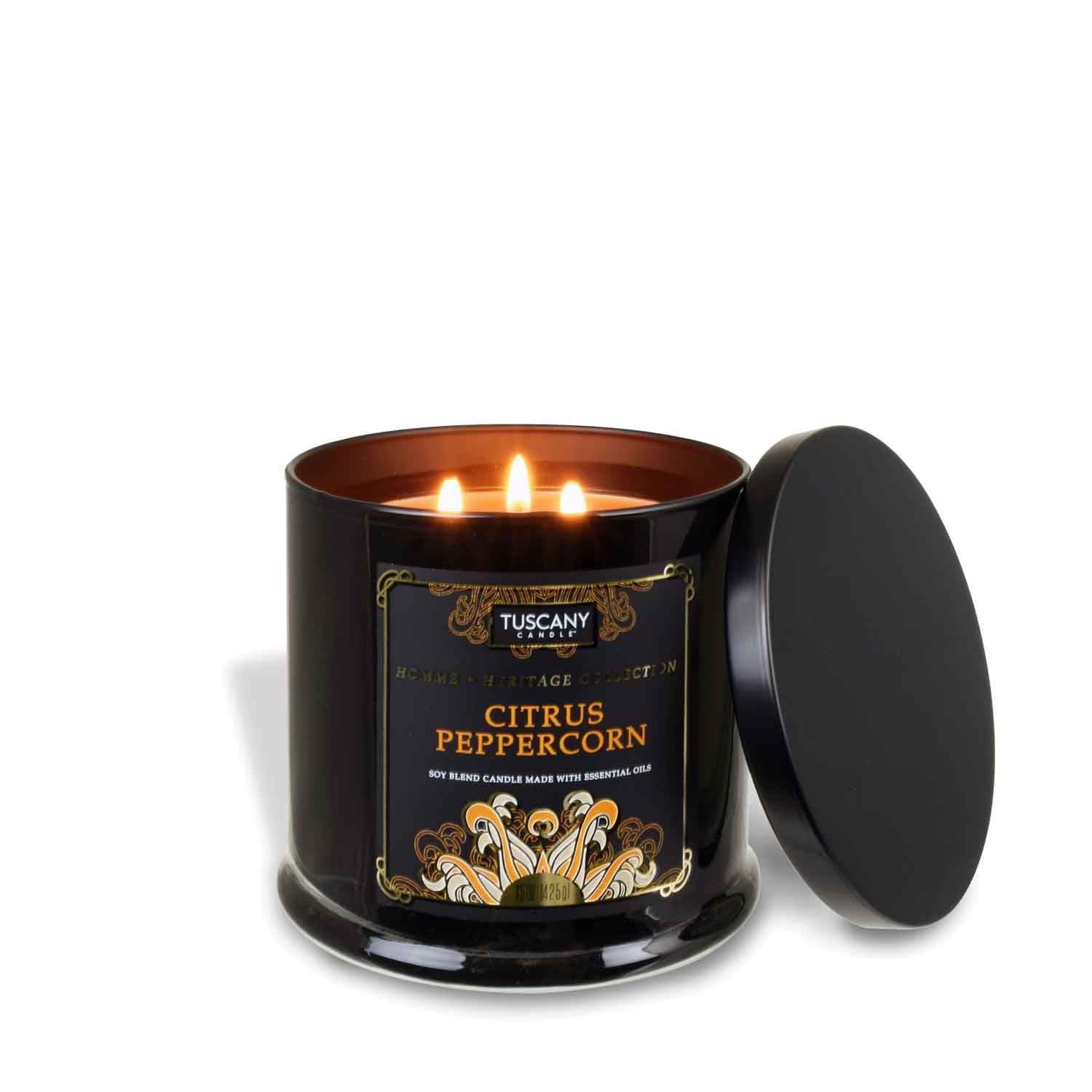 A Citrus Peppercorn scented candle in a black tin on a white background.