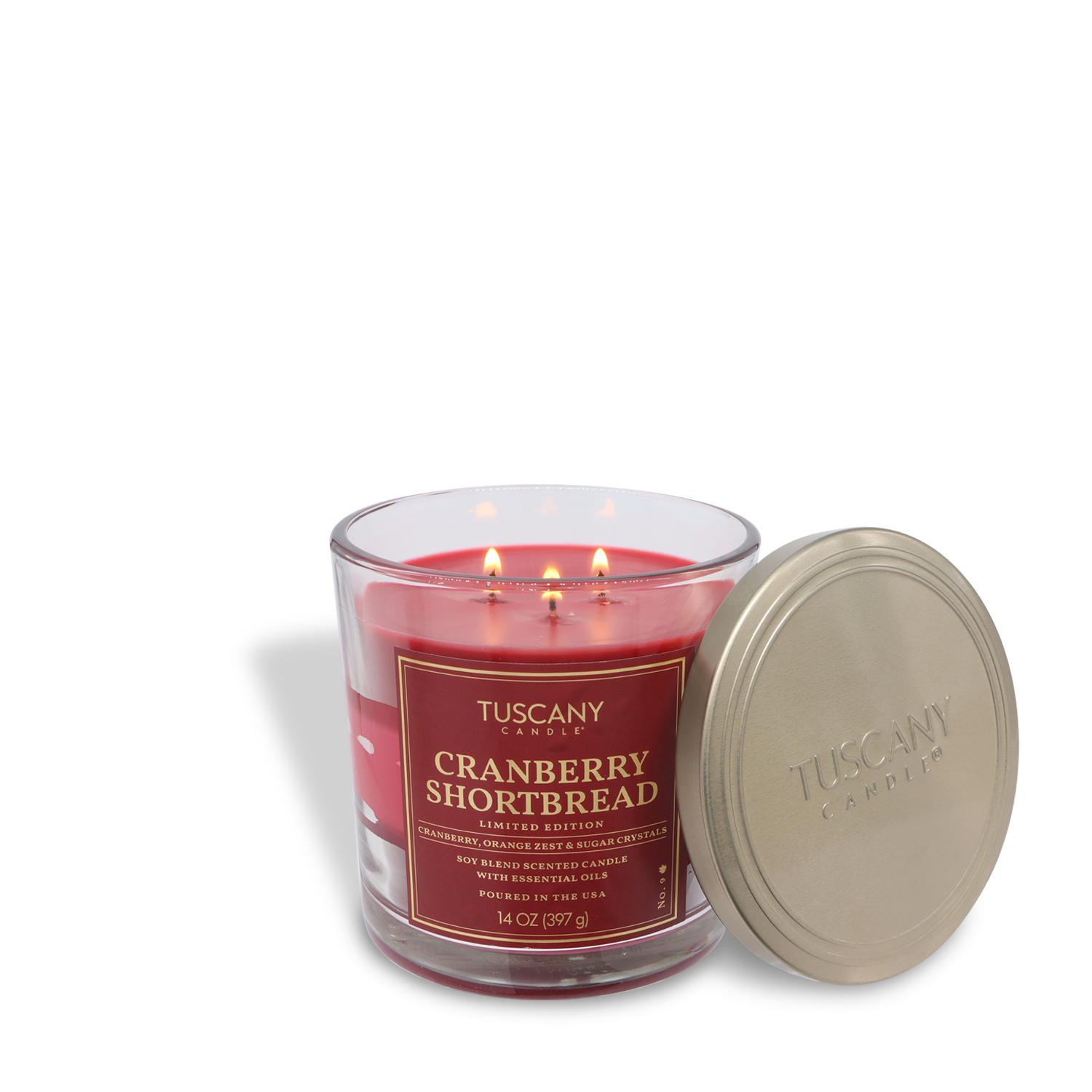 A Tuscany Candle® SEASONAL Cranberry Shortbread: Sweet Cranberry & Sugar scented fall candle (14 oz, three wicks) is displayed in a glass jar with its metallic lid beside it.