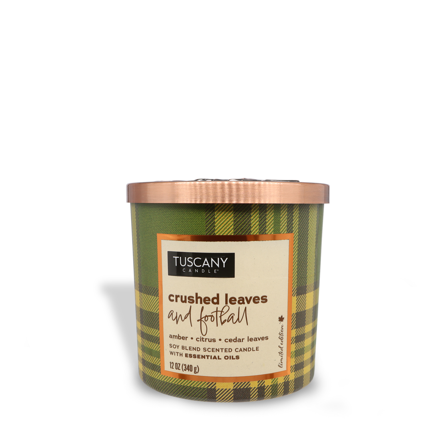 Tuscany Candle® SEASONAL Crushed Leaves and Football Long-Lasting Scented Jar Candle (12 oz) — Autumn Flannels Collection, in a green plaid jar. The label describes the scent as amber, sparkling citrus, and crushed cedar leaves. Made from a soy blend with essential oils.