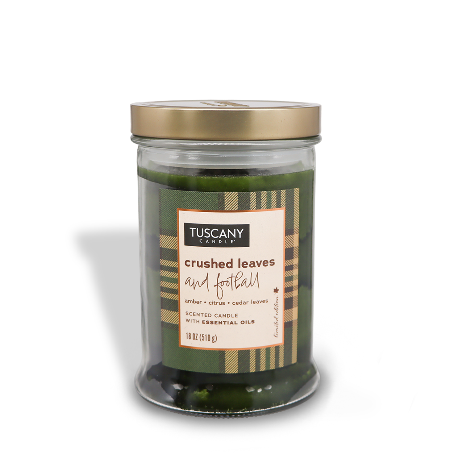 A Tuscany Candle® SEASONAL jar from the Autumn Flannels Collection labeled "Crushed Leaves and Football" with scents of amber, citrus, and cedar leaves. Contains essential oils.