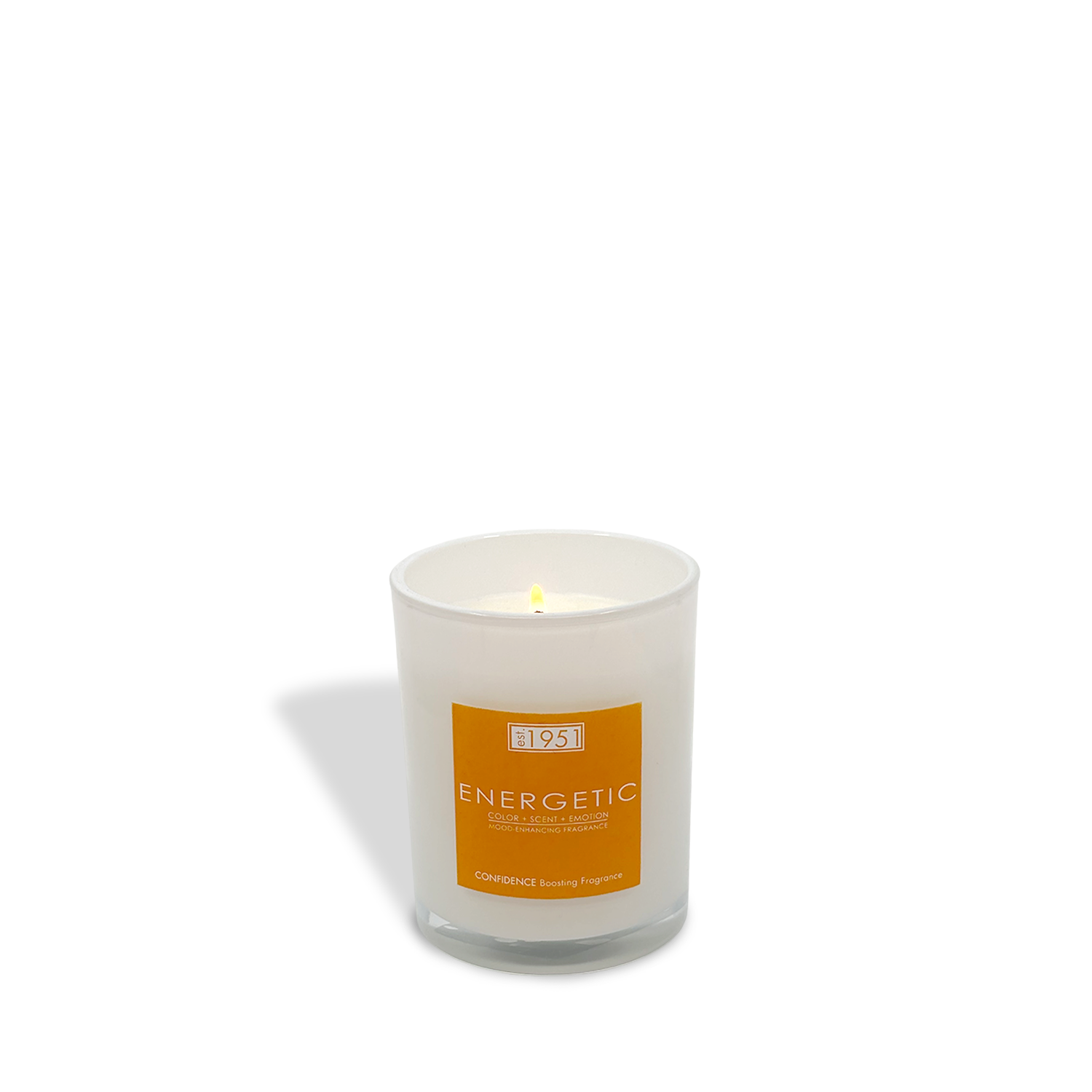 A lit est.1951 "Energy" (8oz) candle in a clear glass jar with an orange label sits on a plain white background—this clean-burning white orange yuzu candle is perfect for uplifting and energizing your space.