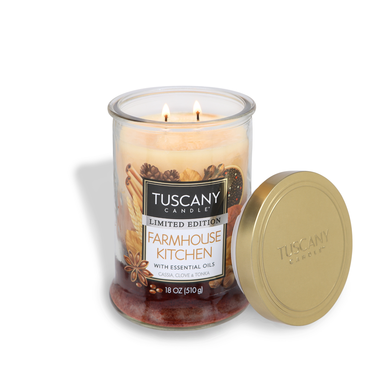 Glass jar Tuscany Candle® SEASONAL labeled "Farmhouse Kitchen Long-Lasting Scented Jar Candle (18 oz)" with marbled wax and essential oils, featuring two lit wicks and an open gold lid beside it. The jar holds an 18 oz (510g) candle.