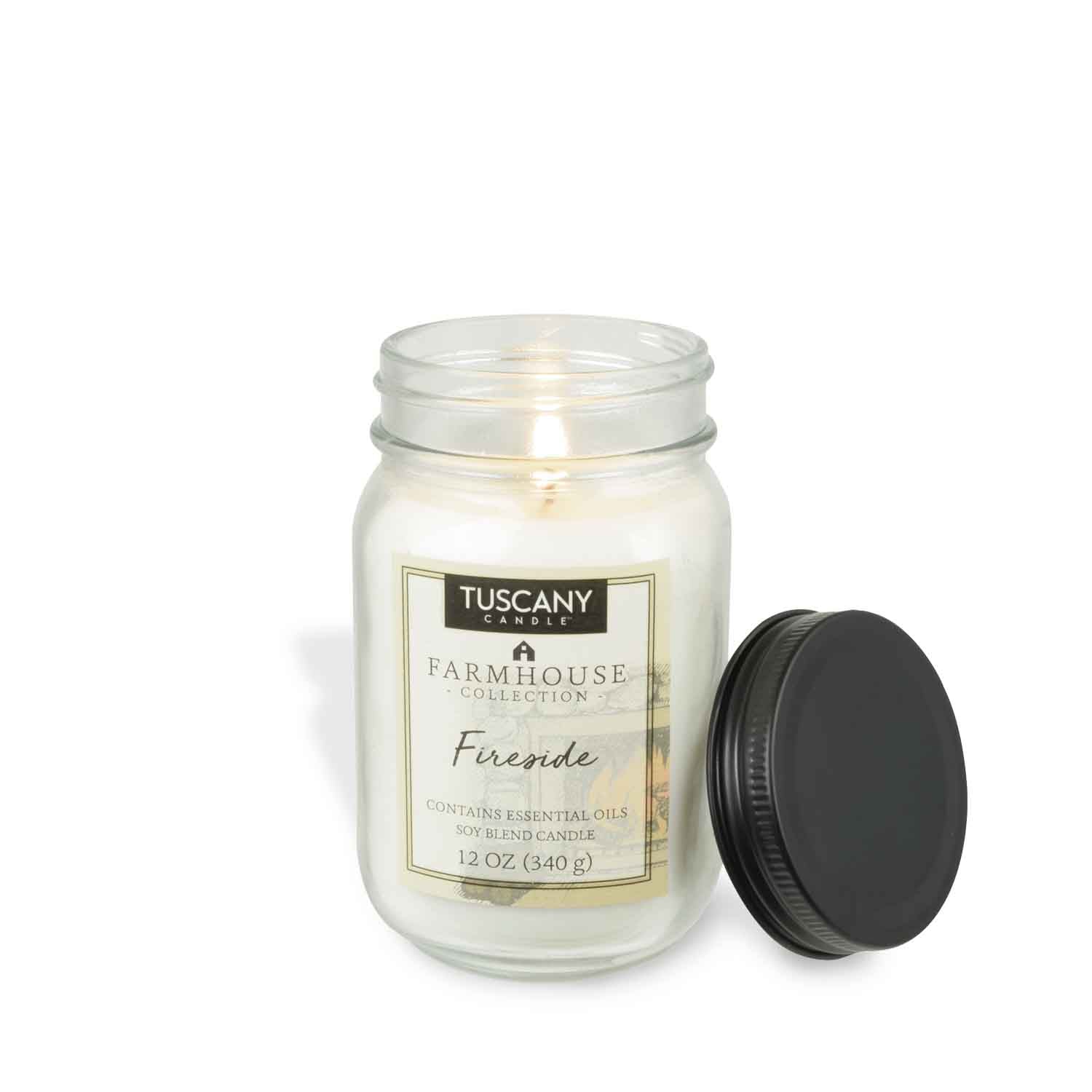 A Fireside Scented Jar Candle (12 oz) in a Tuscany Candle mason jar with a black lid, adding a rustic touch to our farmhouse collection.