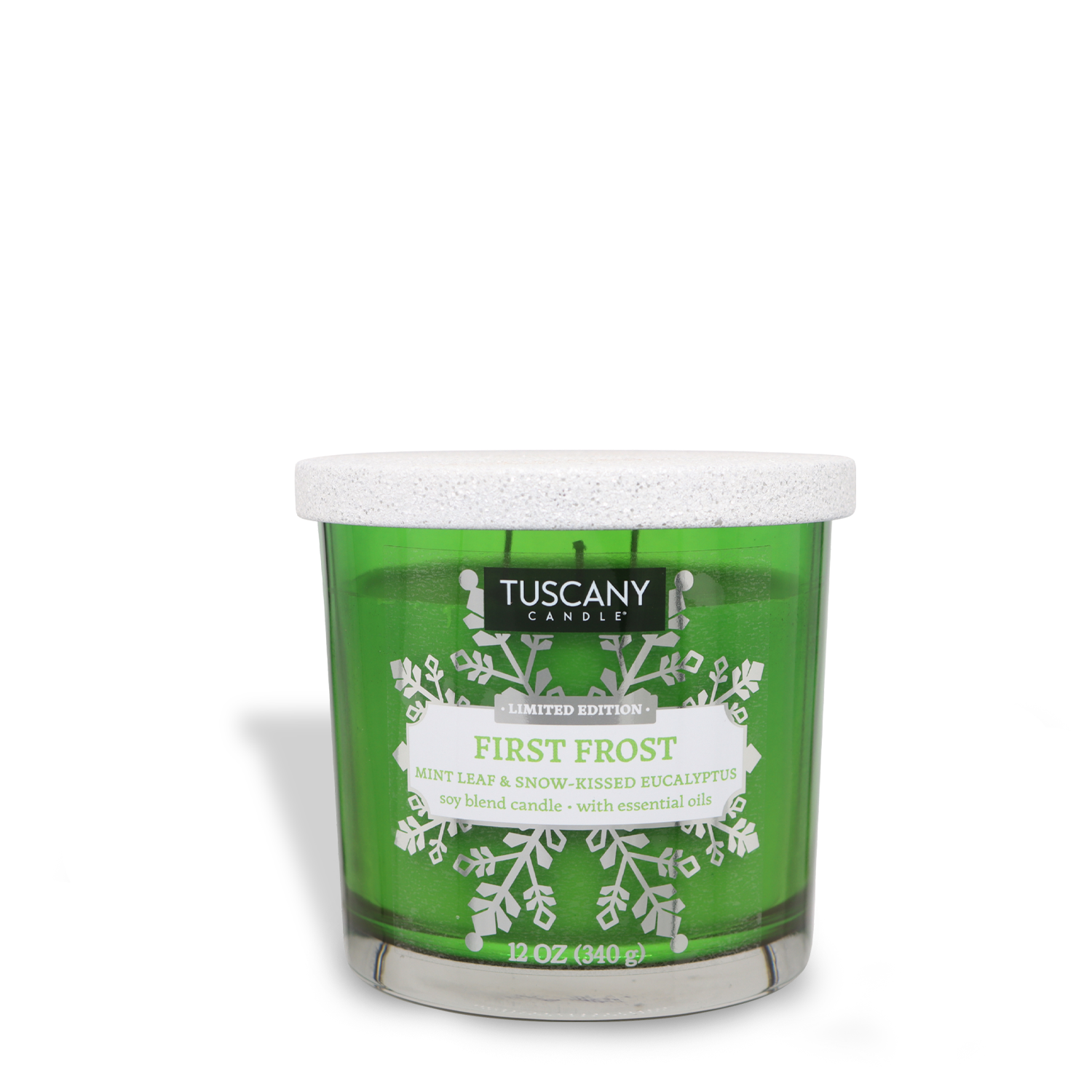 A green "First Frost" Scented Jar Candle from Tuscany Candle® SEASONAL, featuring mint leaf and snow-kissed eucalyptus scents, in a 12 oz jar with a white lid and snowflake design on the front.