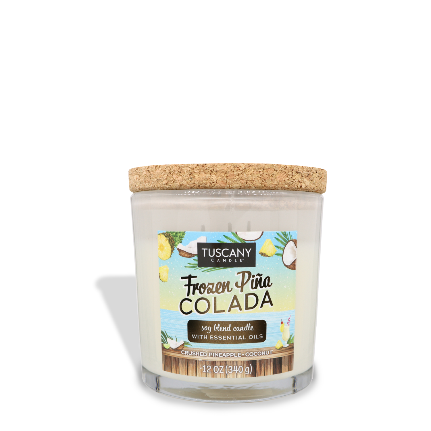 A clear glass candle jar with a cork lid, labeled "Frozen Pina Colada (12 oz) – Sunset Beach Bar Collection" by Tuscany Candle® SEASONAL. The candle features scents of soft coconut and crushed pineapple, evoking a tropical paradise. It has a net weight of 12 ounces (340 grams).