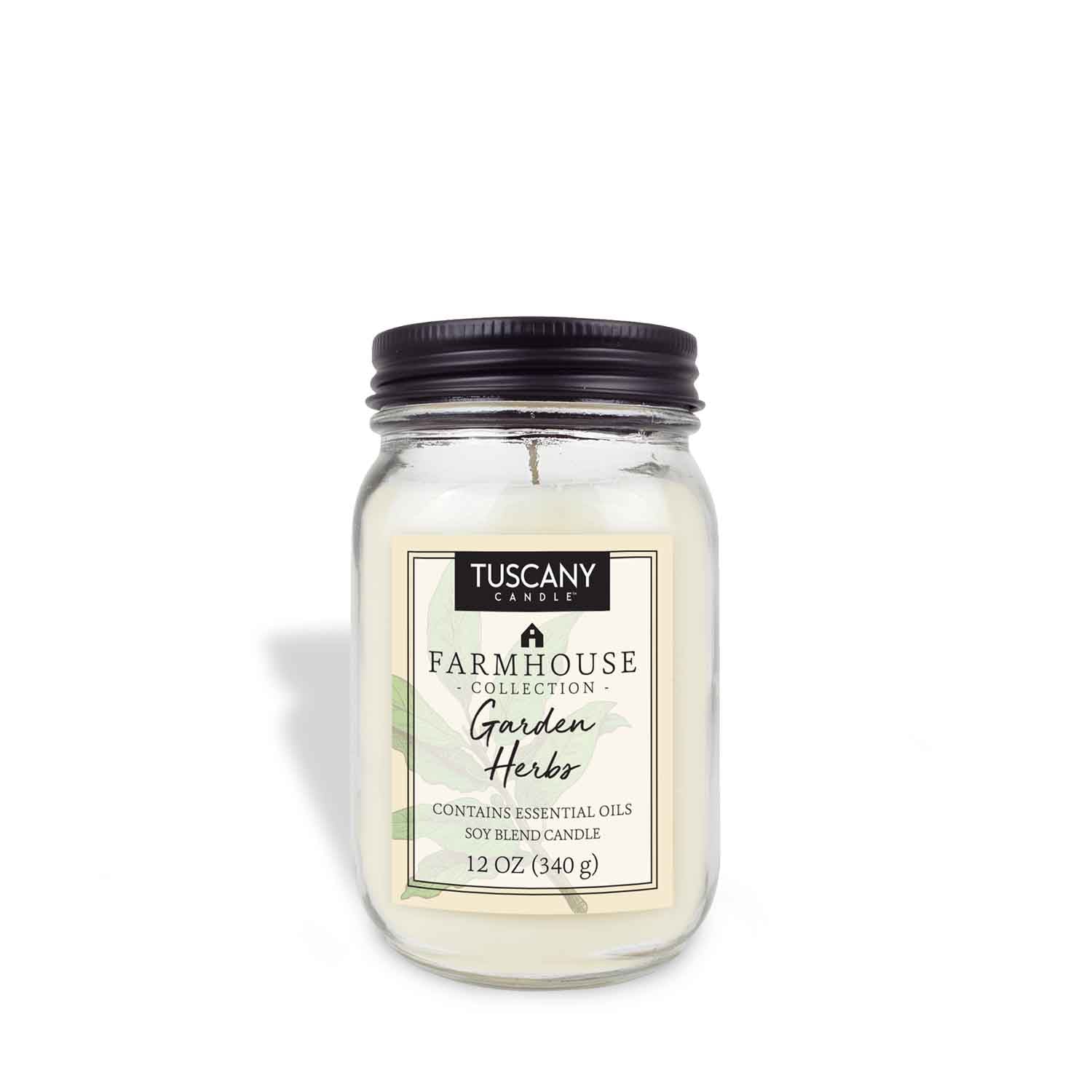A jar with a Garden Herbs Scented Jar Candle (12 oz) - Farmhouse Collection by Tuscany Candle on a white background.