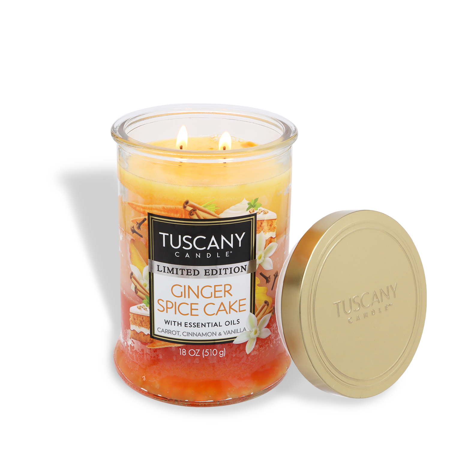 A Tuscany Candle® SEASONAL Ginger Spice Cake: Carrot & Vanilla Scented Fall Candle (18 oz) features two lit wicks, its lid beside it. This limited edition candle is made with essential oils.
