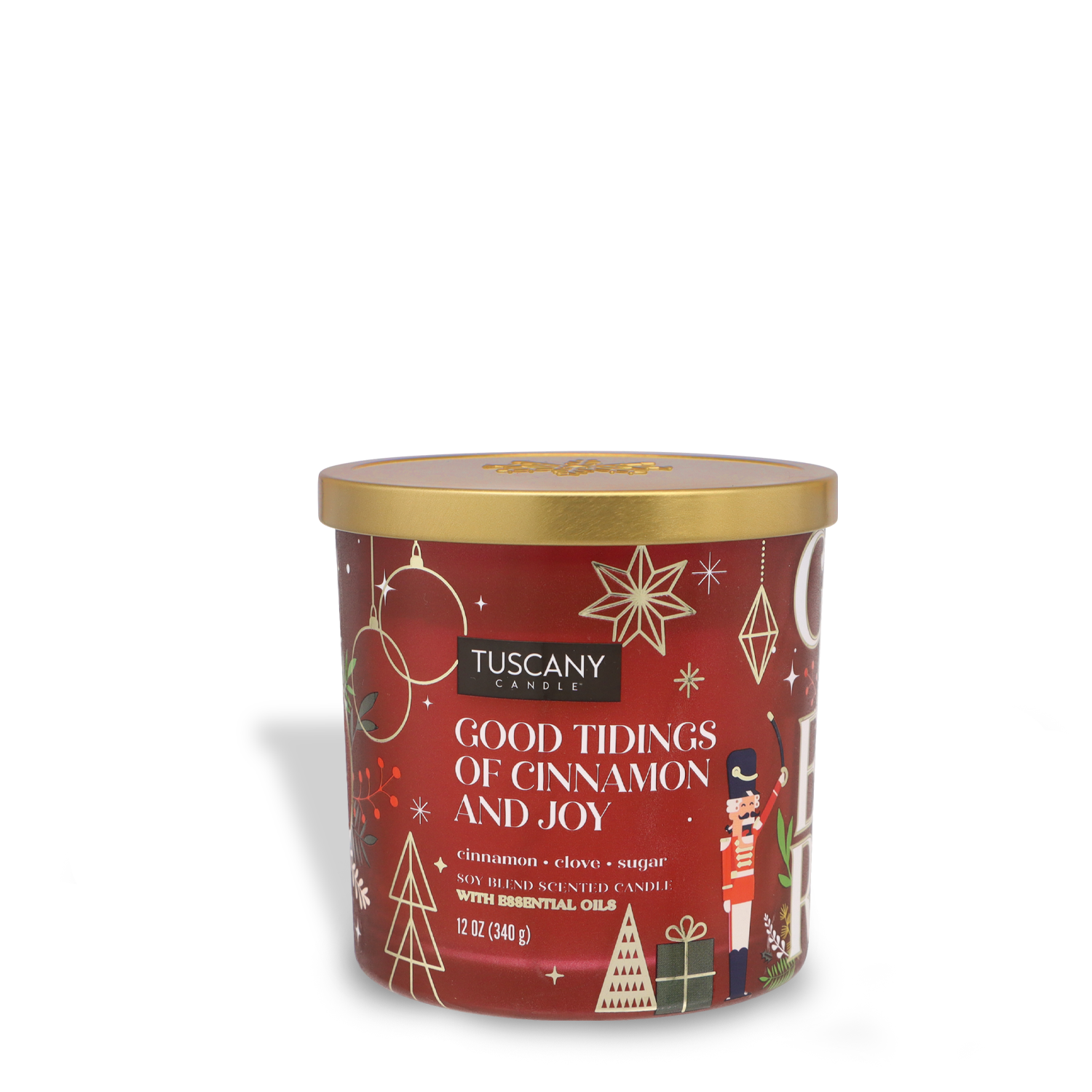 A 12 oz jar candle from Tuscany Candle® SEASONAL, labeled "Good Tidings of Cinnamon & Joy," features a cinnamon, clove, and sugar scent. It is adorned with holiday-themed designs and includes a gold lid.