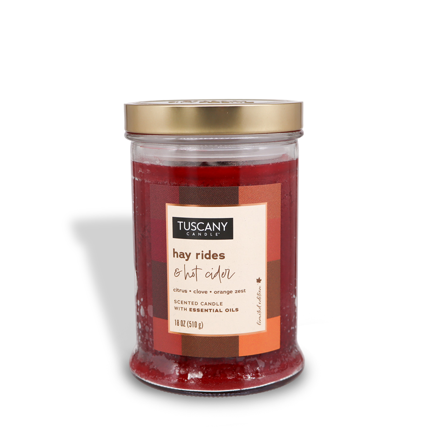 The Tuscany Candle® SEASONAL "Hay Rides & Hot Cider" Long-Lasting Scented Jar Candle (18 oz) from the Autumn Flannels Collection features notes of citrus, clove, and orange zest, all contained in a glass jar with a gold lid.
