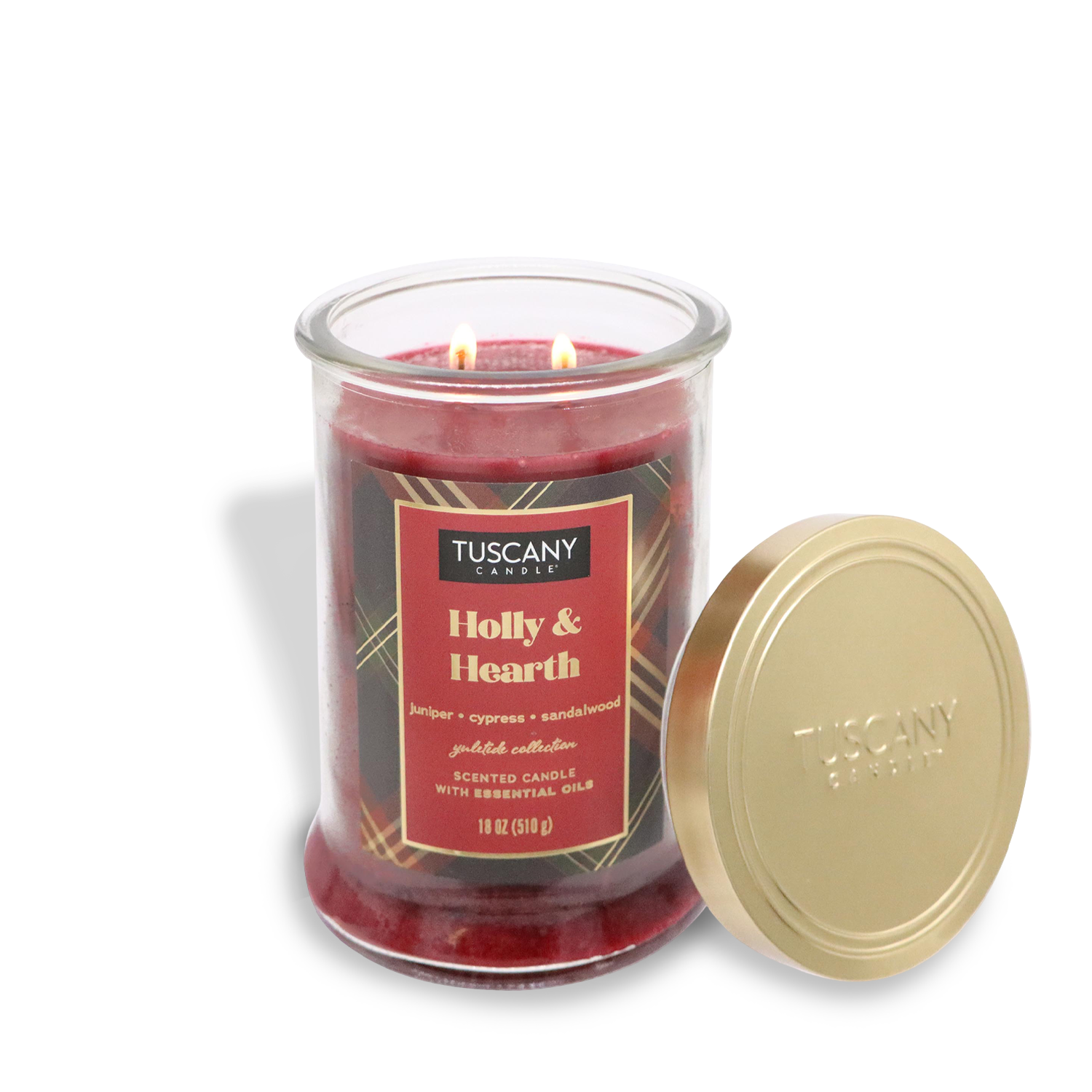 An 18 oz jar candle from Tuscany Candle® SEASONAL's Winter Flannels Collection, named "Holly & Hearth," featuring a juniper, cypress, and sandalwood scent with its lid removed.