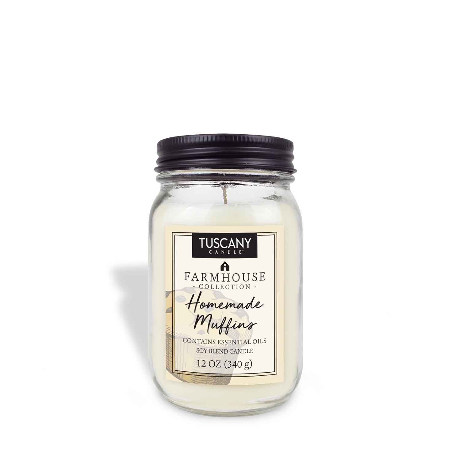 A Homemade Muffins Scented Jar Candle (12 oz) from the Farmhouse Collection by Tuscany Candle® EVD with a candle on it.