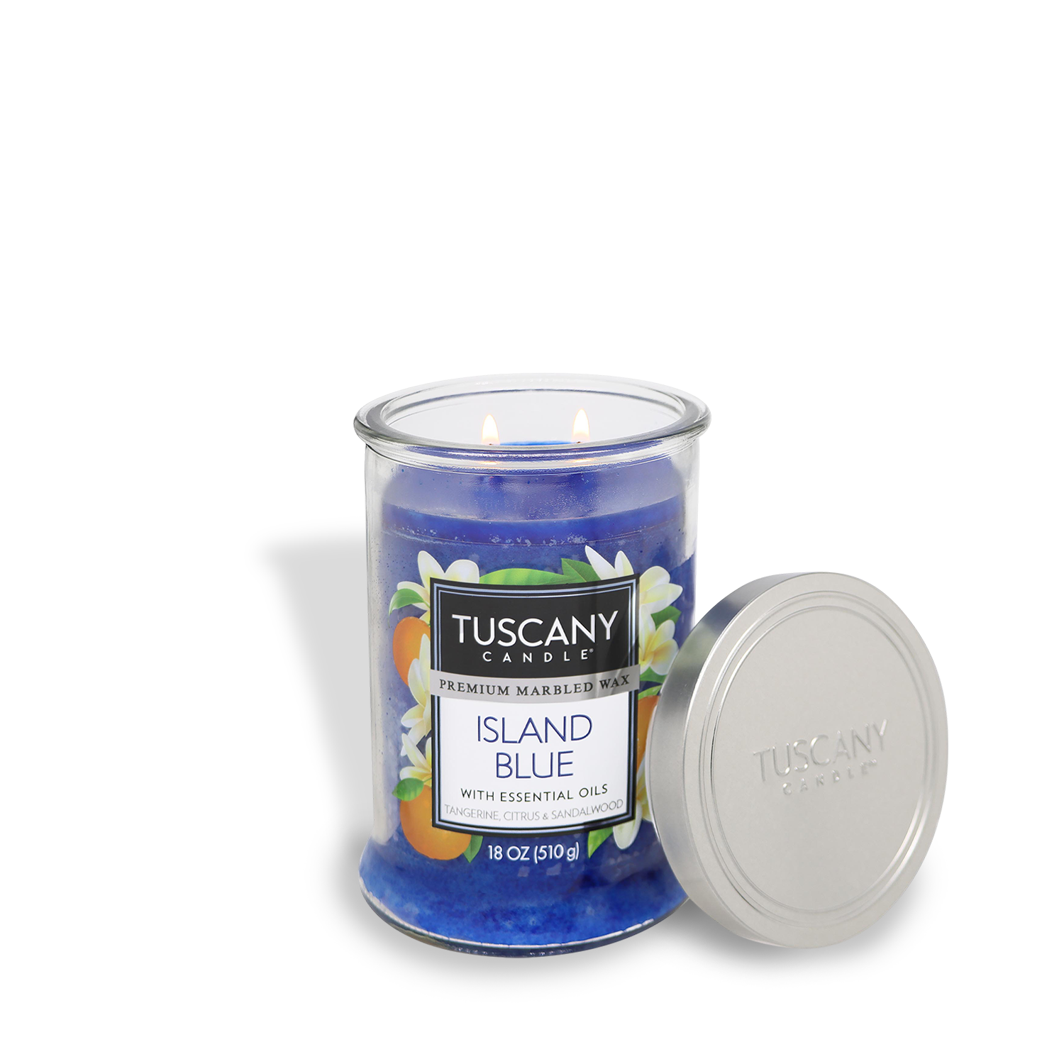 The Tuscany Candle® EVD Island Blue Long-Lasting Scented Jar Candle (18 oz) comes in a blue glass jar with a silver lid, and features essential oils with jasmine, citrus, and sandalwood notes.