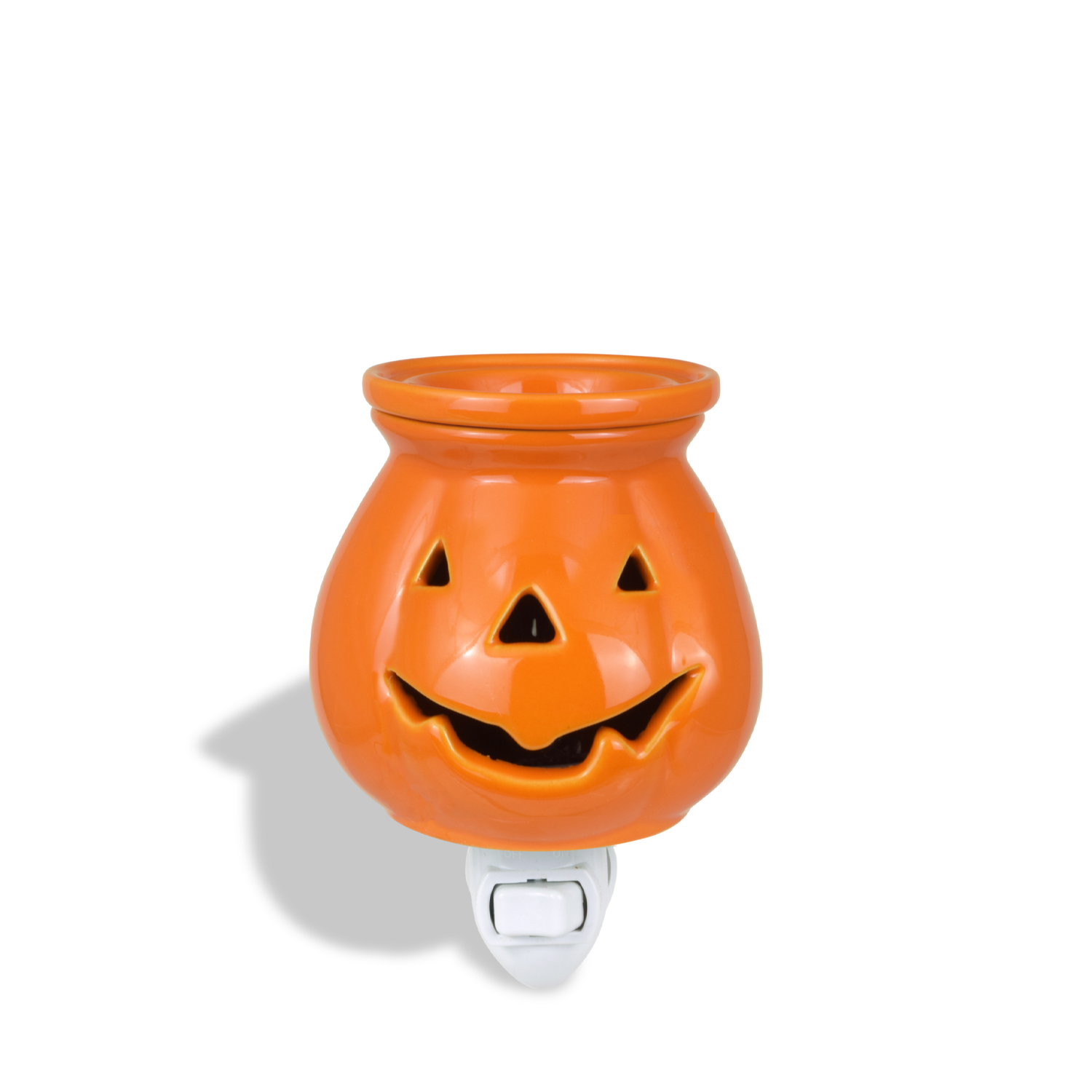 An orange pumpkin-shaped ceramic night light with a carved smiling face, designed for a flame-free environment perfect for seasonal or Halloween decoration, the Jack O' Lantern Outlet Wax Melt Warmer by Tuscany Candle® SEASONAL.