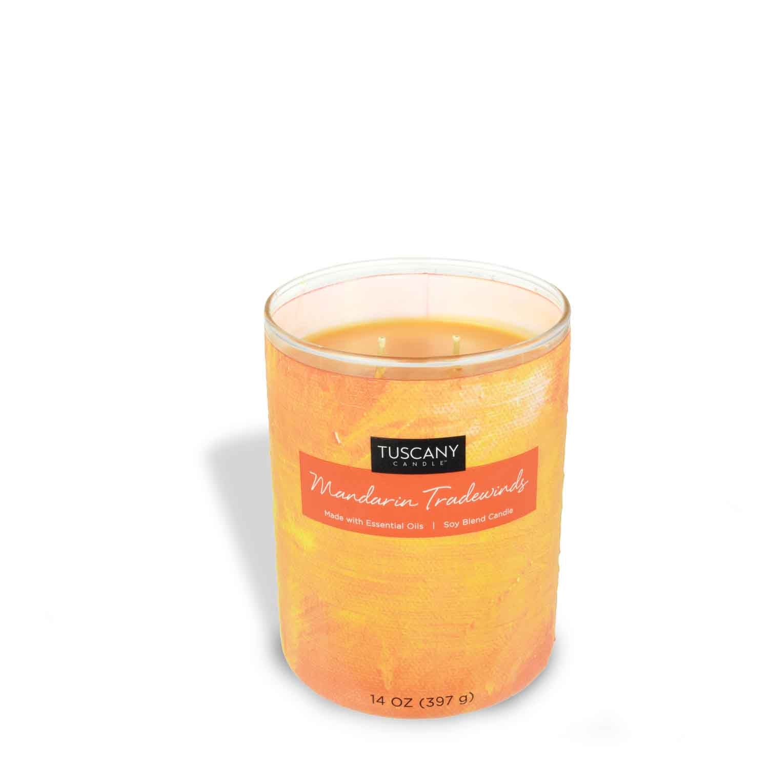 An Mandarin Tradewinds scented jar candle (14 oz) from the Tuscany Candle brand, in a glass on a white background, perfect for enhancing home décor.