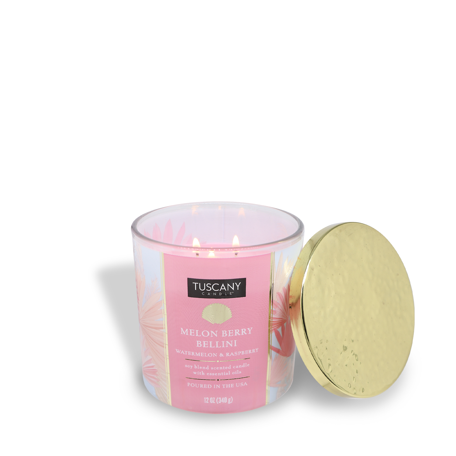 This limited-edition 12 oz Melon Berry Bellini candle from Tuscany Candle® SEASONAL’s Island Glam Collection features a luscious watermelon scent and three wicks, shown lit beside its gold-colored lid.