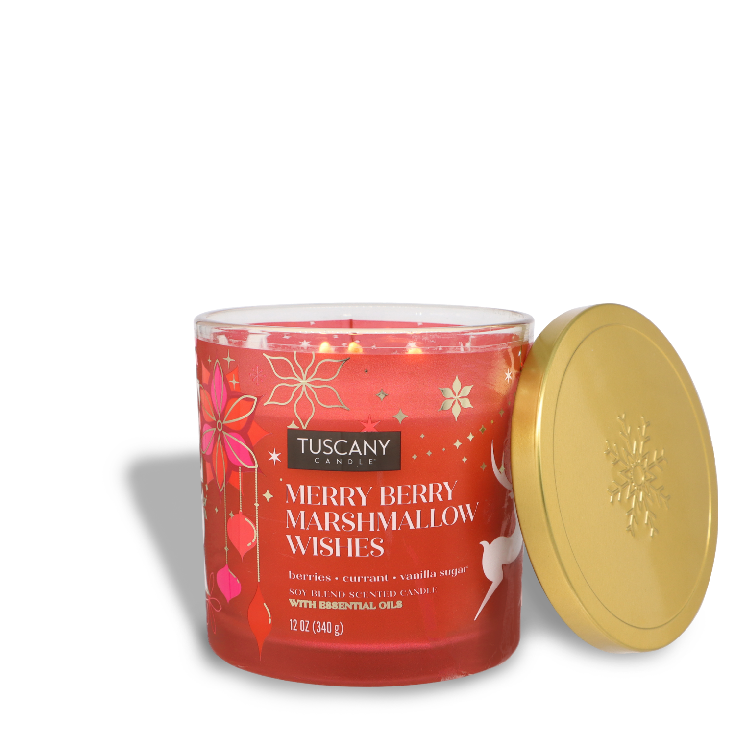 A 12 oz Tuscany Candle® SEASONAL jar candle in red, scented "Merry Berry Marshmallow Wishes," with a gold lid next to it.