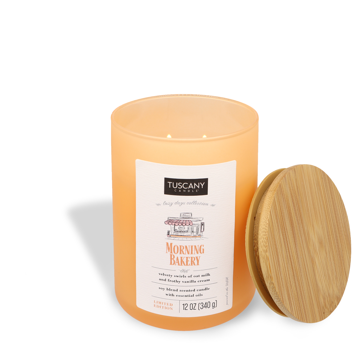 Morning Bakery scented candle with Tuscany Candle® SEASONAL label and wooden lid on a white background.