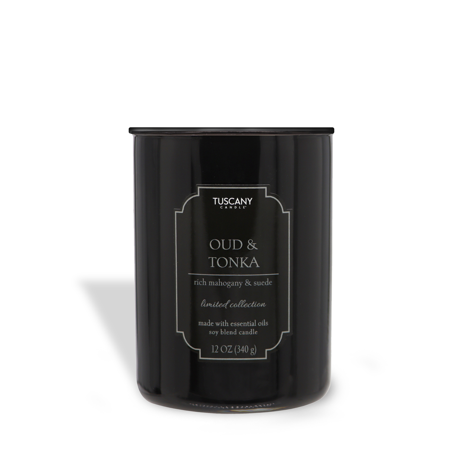 A black soy candle in a cylindrical container labeled "Oud & Tonka (12 oz) – Colorsplash Collection" with scent descriptions, against a white background. (Tuscany Candle® EVD)