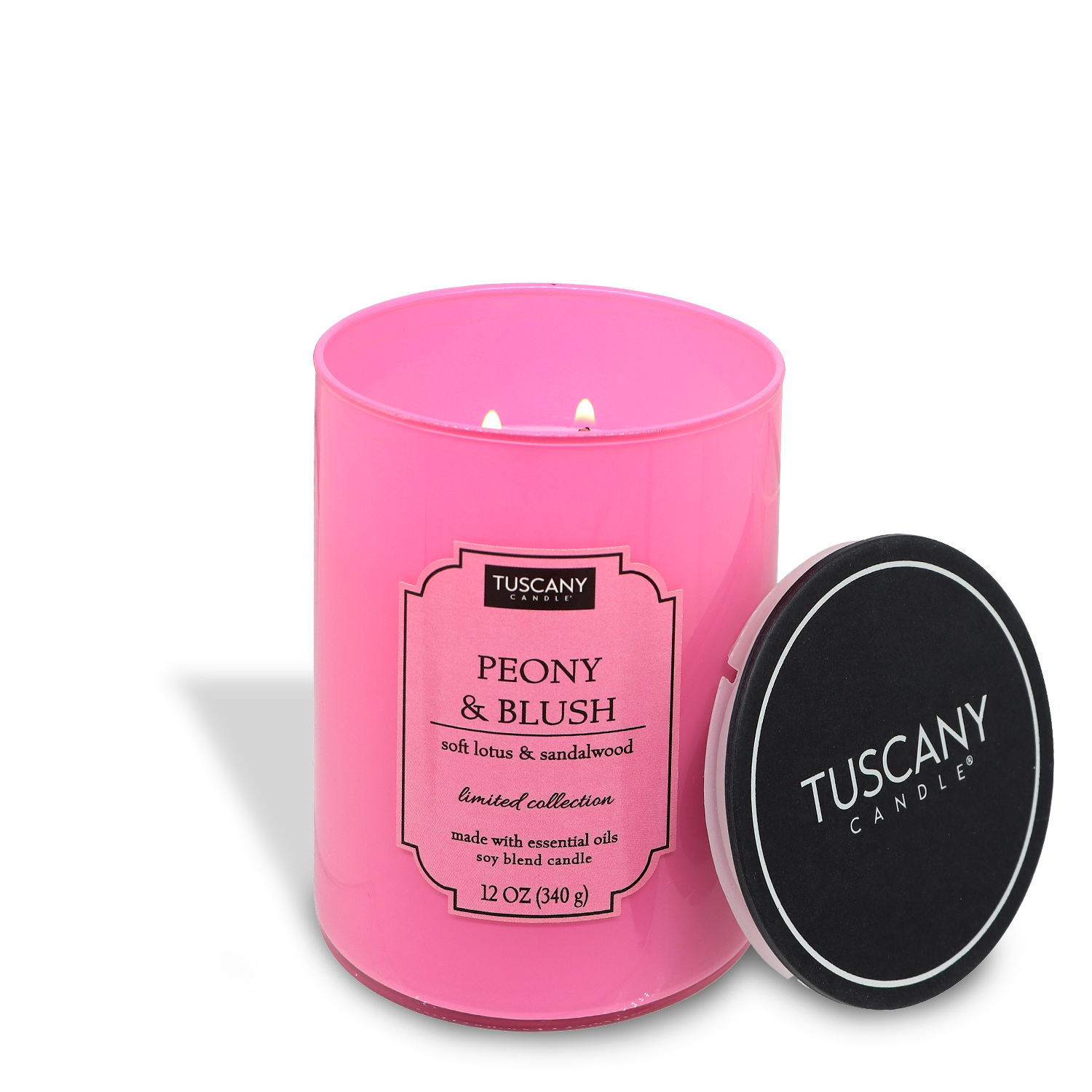 A pink Tuscany Candle® EVD Colorsplash Collection candle labeled "Peony & Blush" with three wicks, next to its black lid on a white background.
